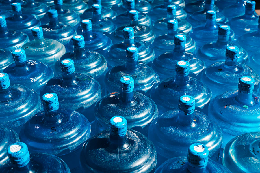 Rows of blue 19-liter water bottles