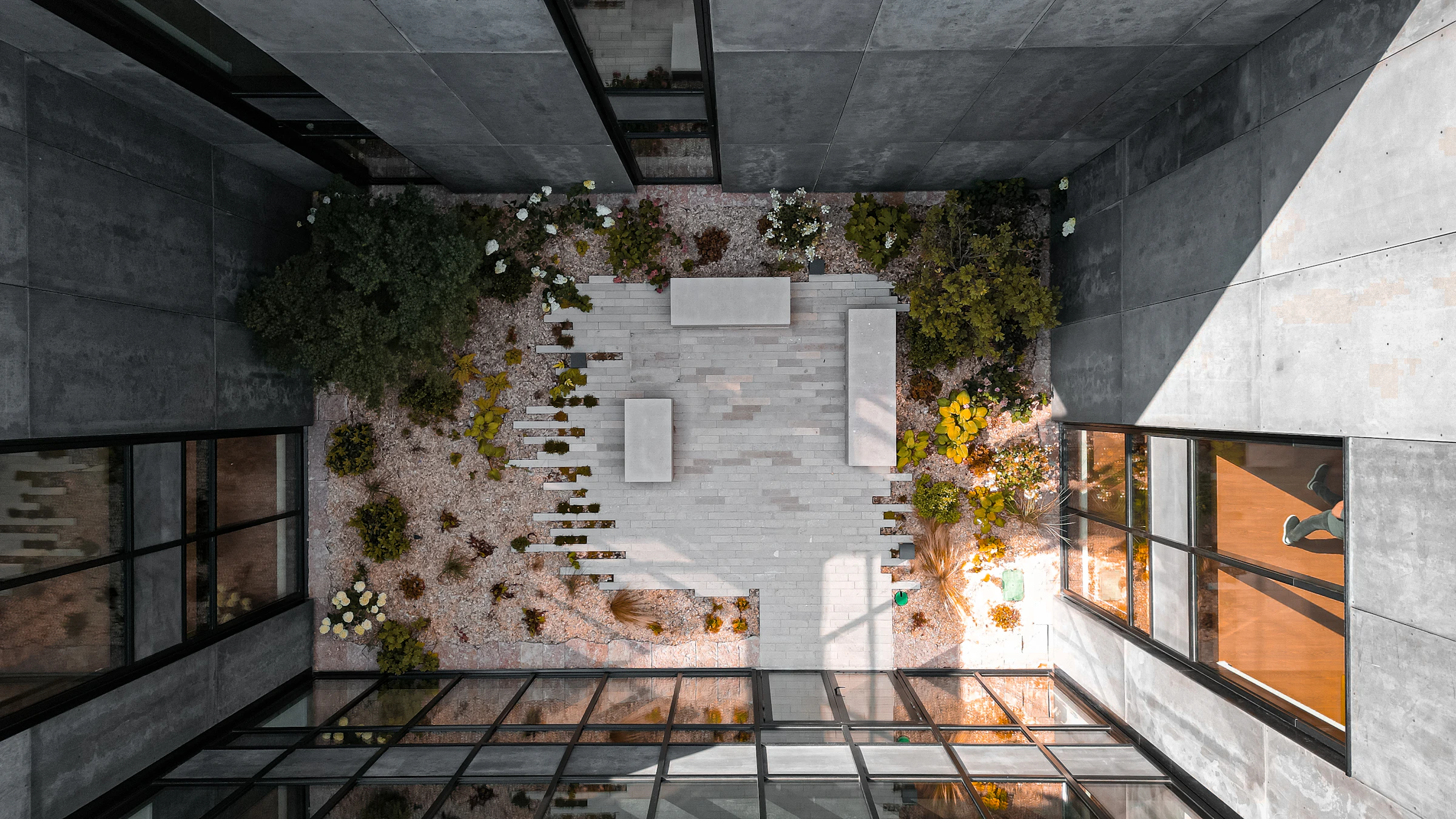Sculptural concrete residence with deep terraces and open living spaces