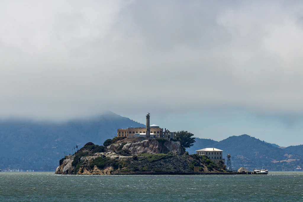 Officially, nobody ever escaped from Alcatraz. The Rock is a film about the one man who did. NVIDIA's OpenShell is the third agent sandbox in a year, after Anthropic's and Docker's, and all three are Alcatraz: a cell that decides nothing and a guard outside with the keys. It's least privilege with better ergonomics, and the thing inside still knows the plumbing.