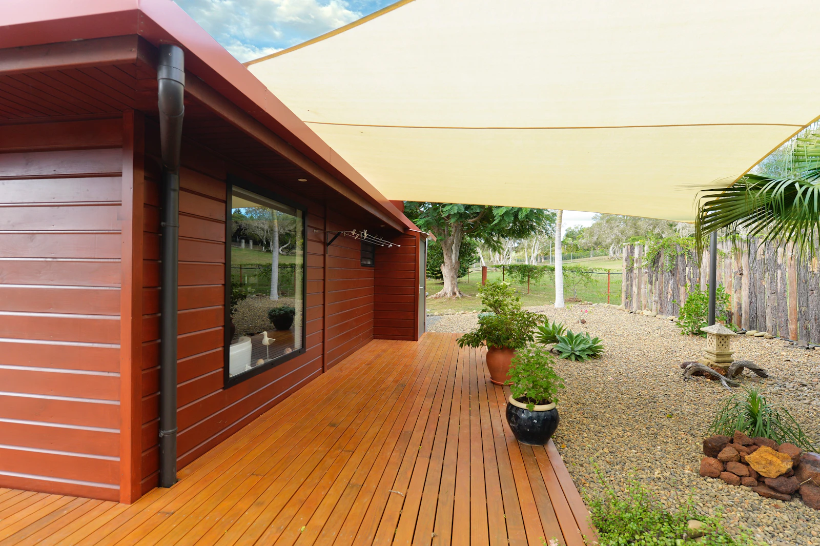 Rural property with deck and landscaping