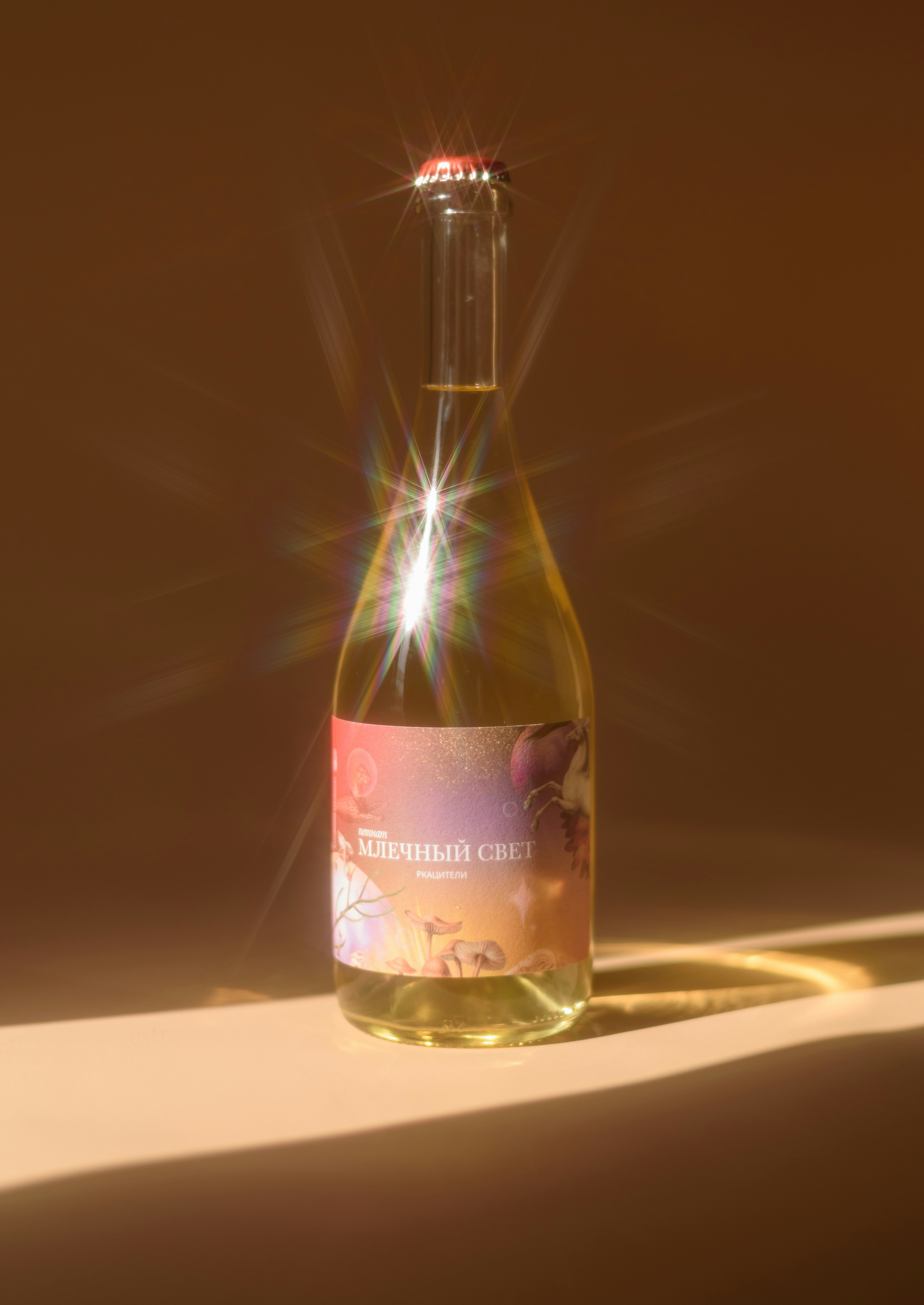A sparkling bottle of light beverage with a colorful label.