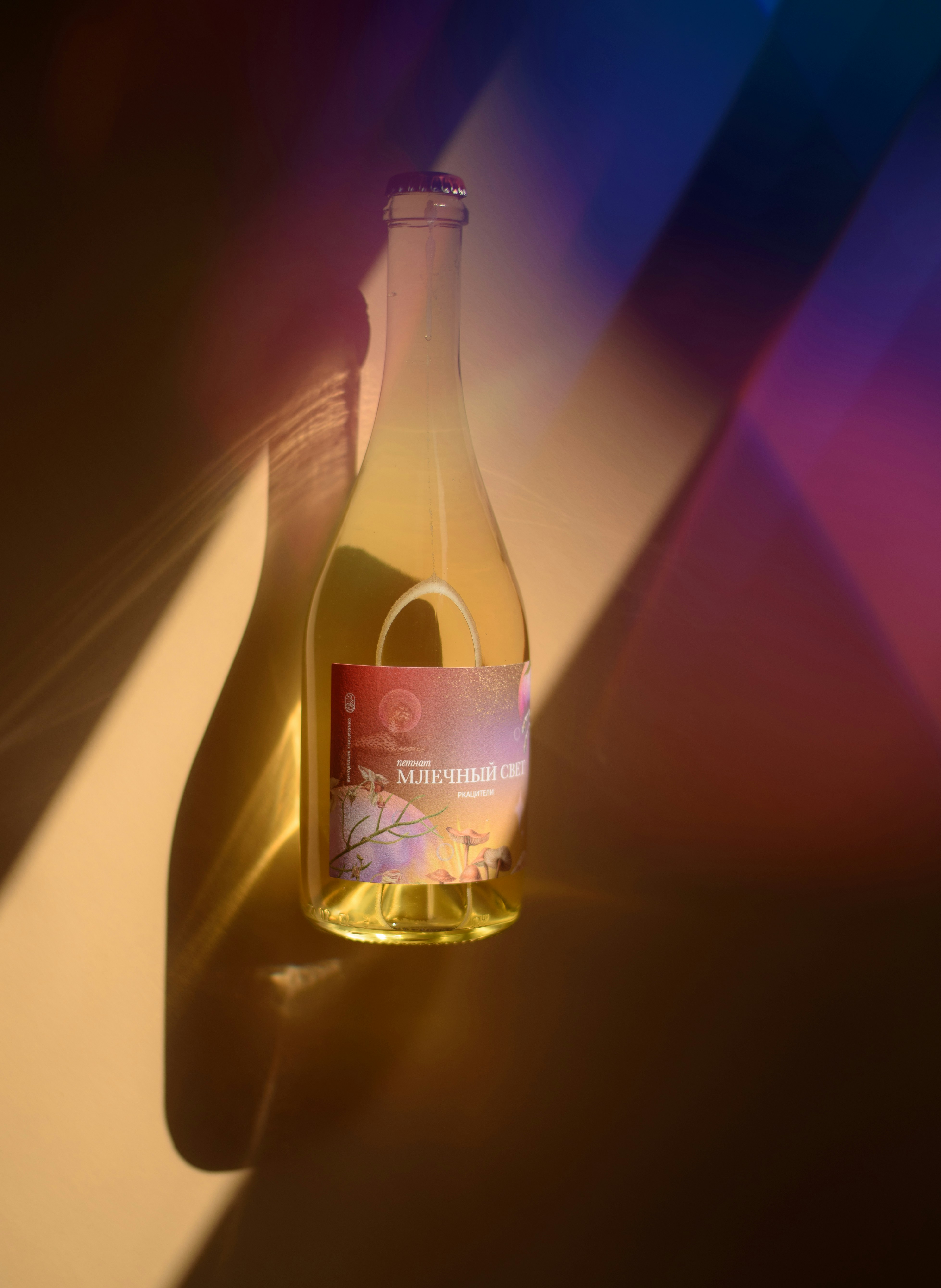 A bottle of wine with colorful light reflections.