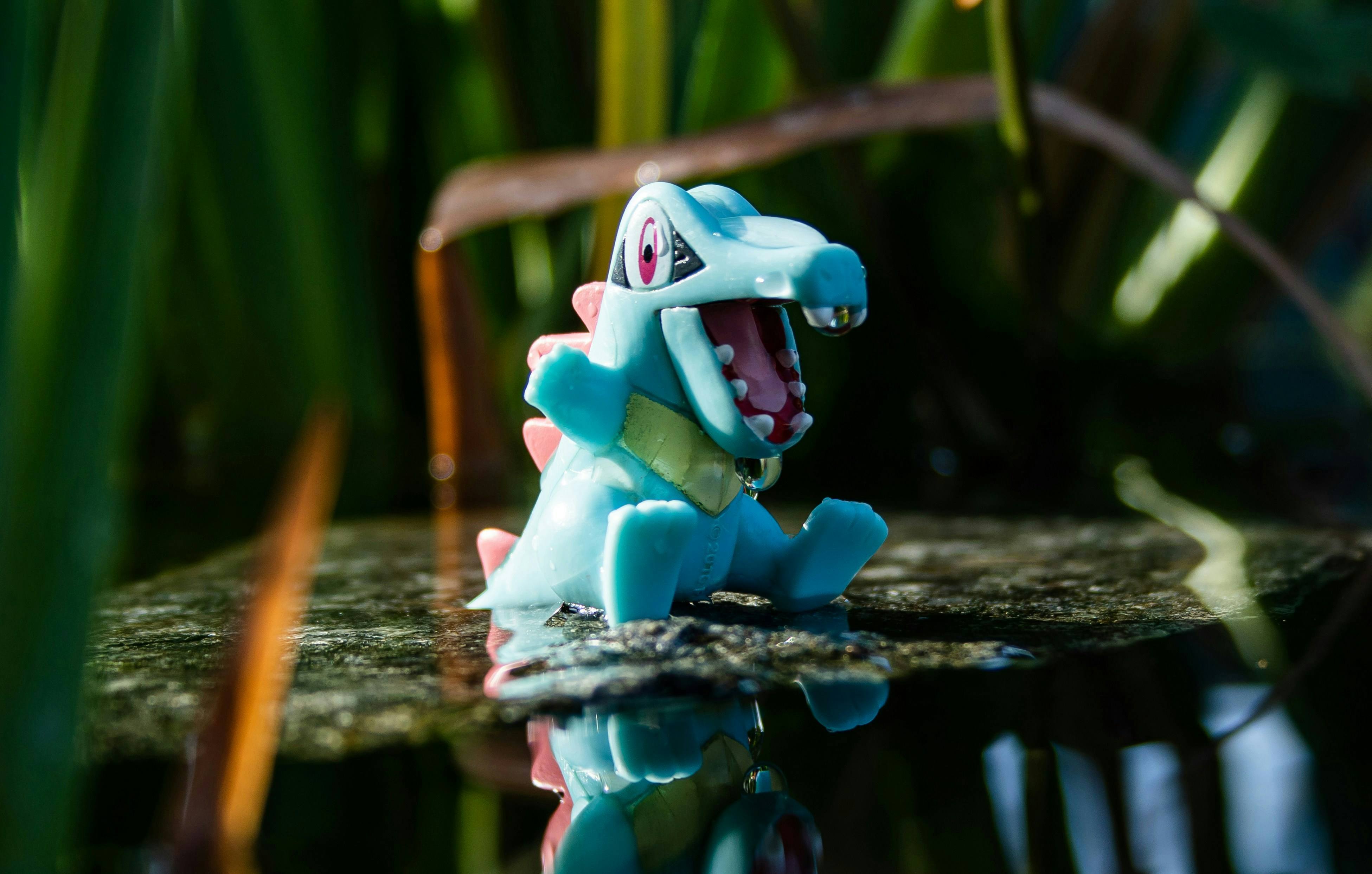 Gaming Blue Crocodile Toy Sits On A Reflective Surface. 4K Wallpaper #2814