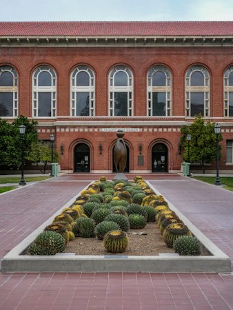 A campus building framed by a cactus garden and desert landscaping, the kind of water-wise design the ULI panel recommended for Nevada State University