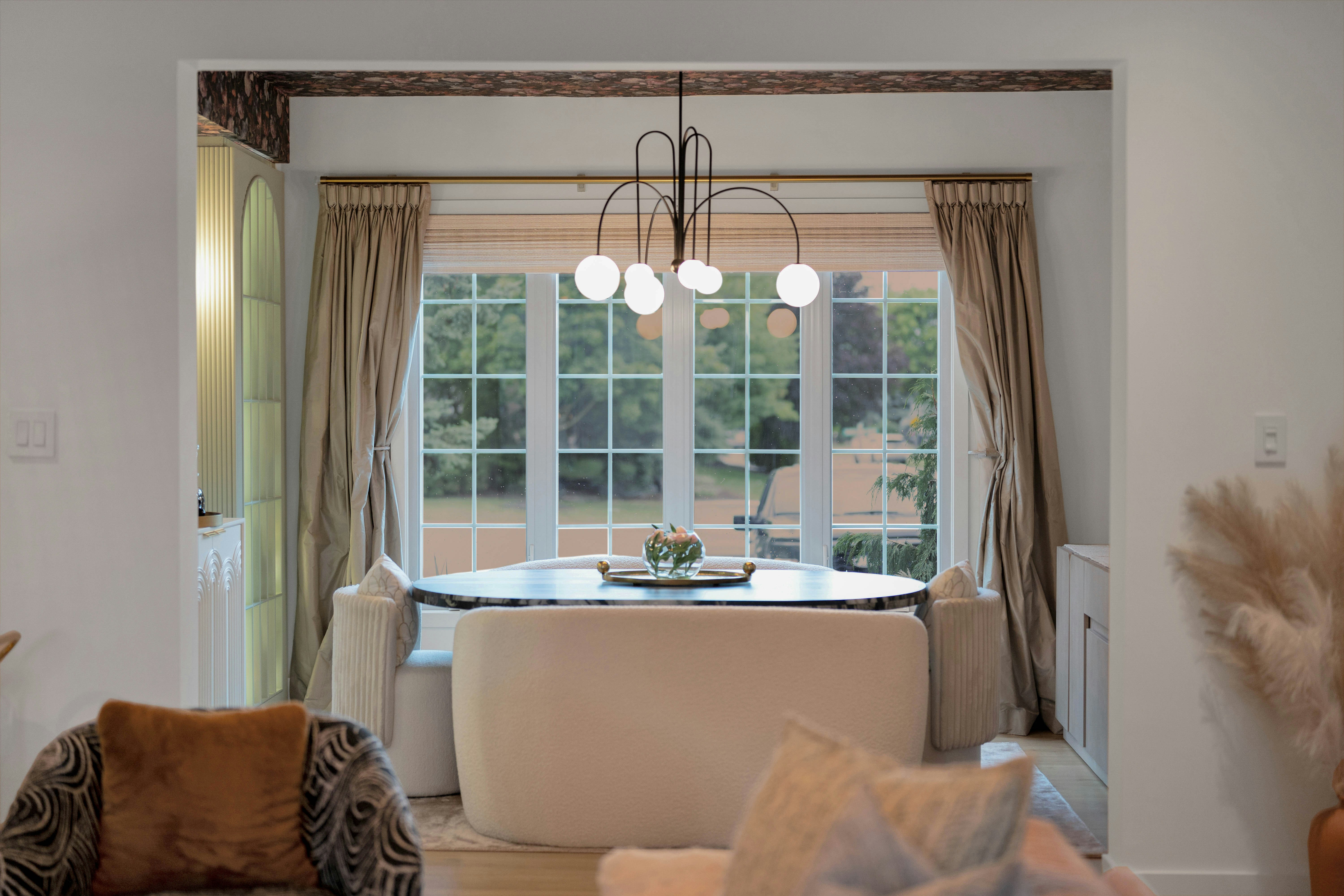 Elegant dining nook with a round table and large window — the Green Room breakfast setting