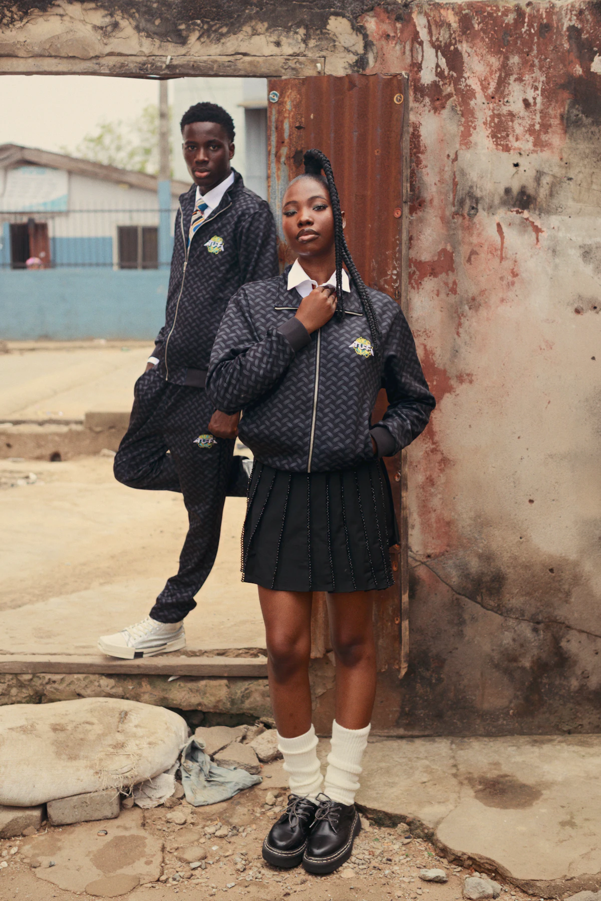Two students in school uniform standing together