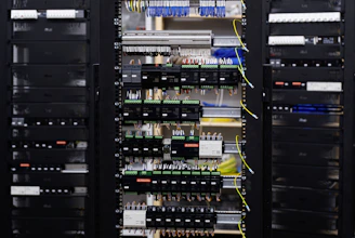 Open electrical control panel with wires and circuit breakers.