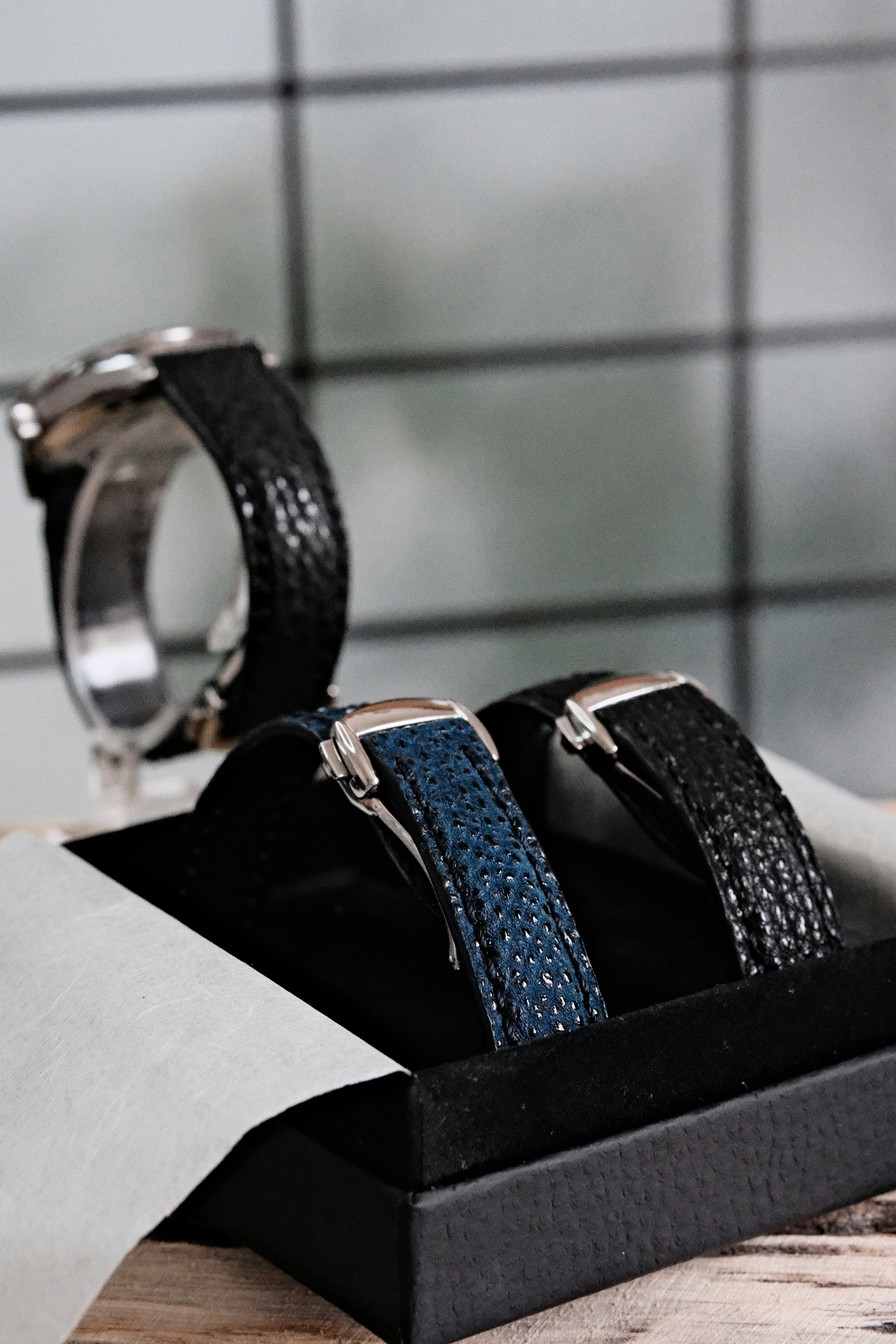Two elegant stingray watch straps displayed in a black box.