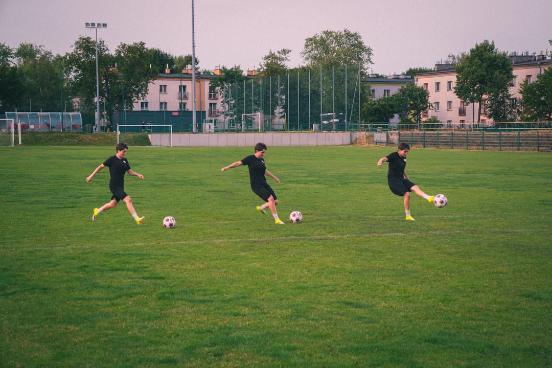 Sequential motion of a person kicking a soccer ball.