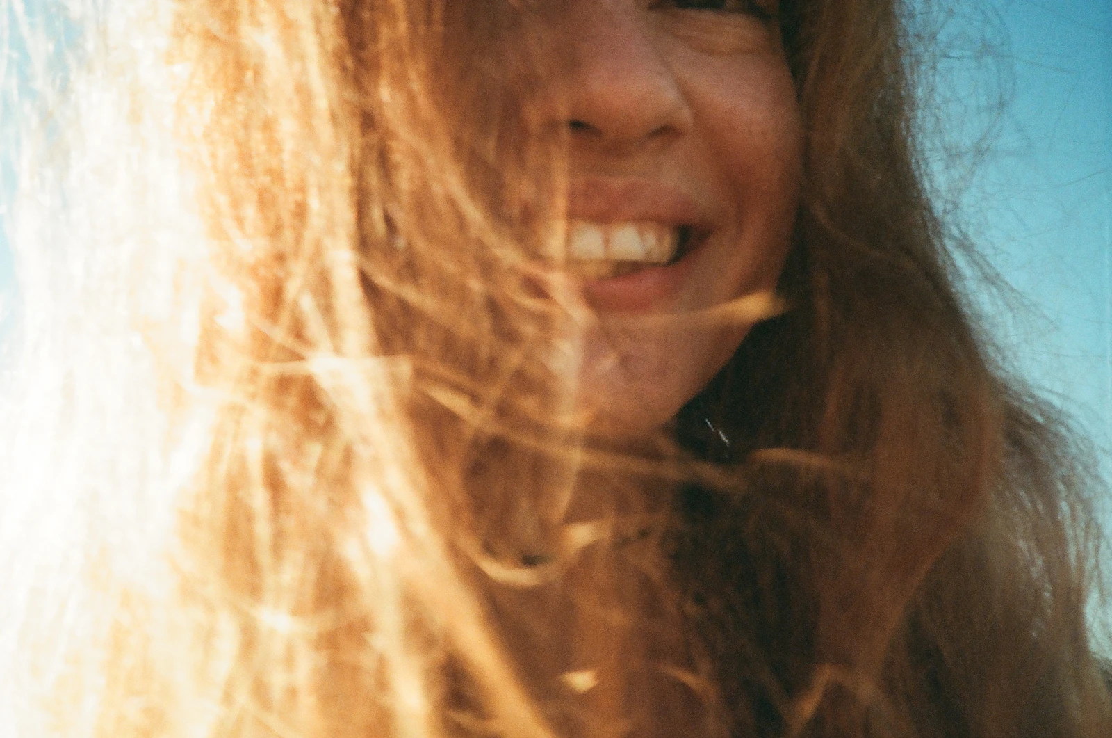 long windblown hair in soft outdoor light