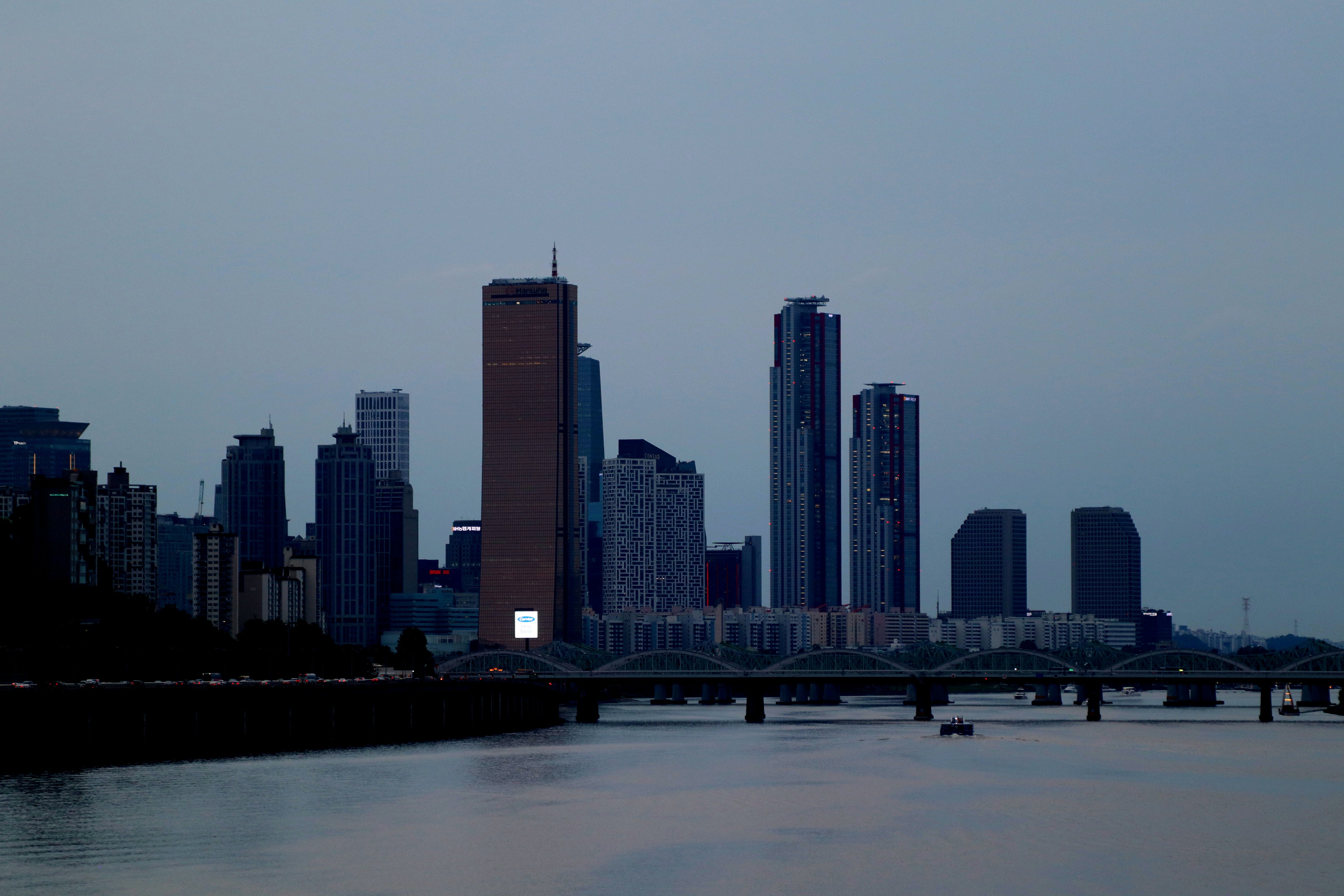 City Skyline With Tall Buildings And A River At Dusk. 4K Wallpaper #3551