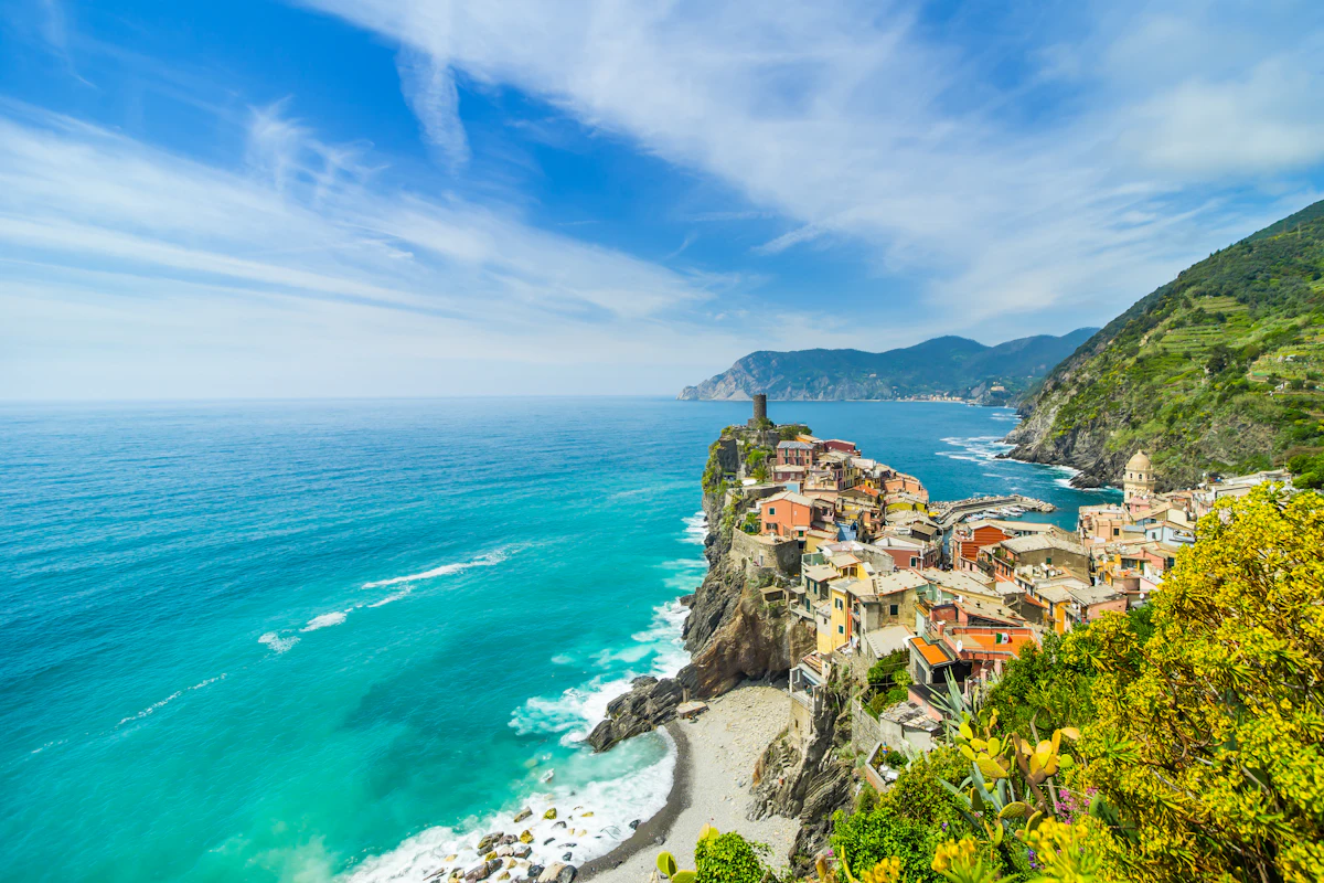 Vernazza's coloured houses on the cliffs above the turquoise Ligurian sea