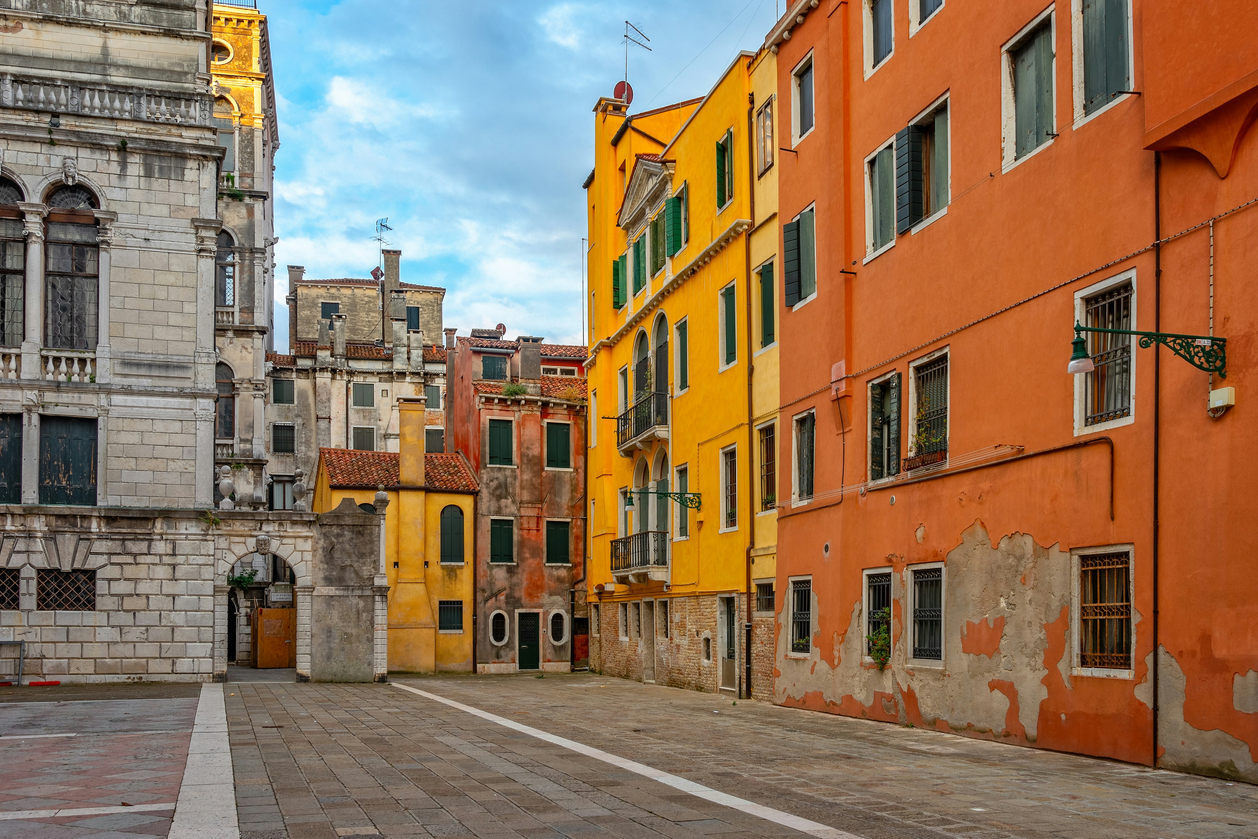 Vibrant historic buildings frame an empty european city square