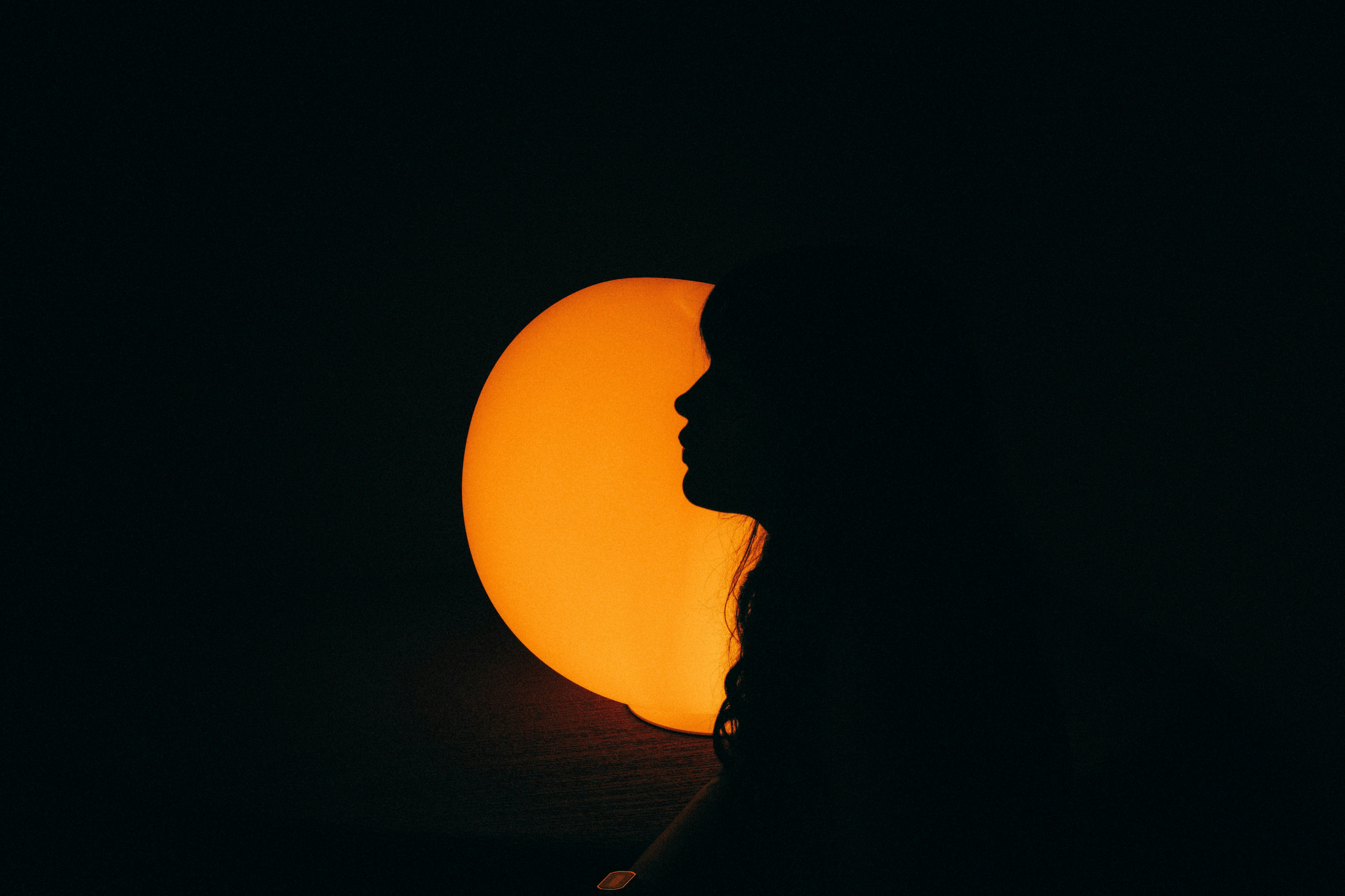 Abstract Silhouette Of A Person Against A Bright Orange Sun. 4K Wallpaper #2795