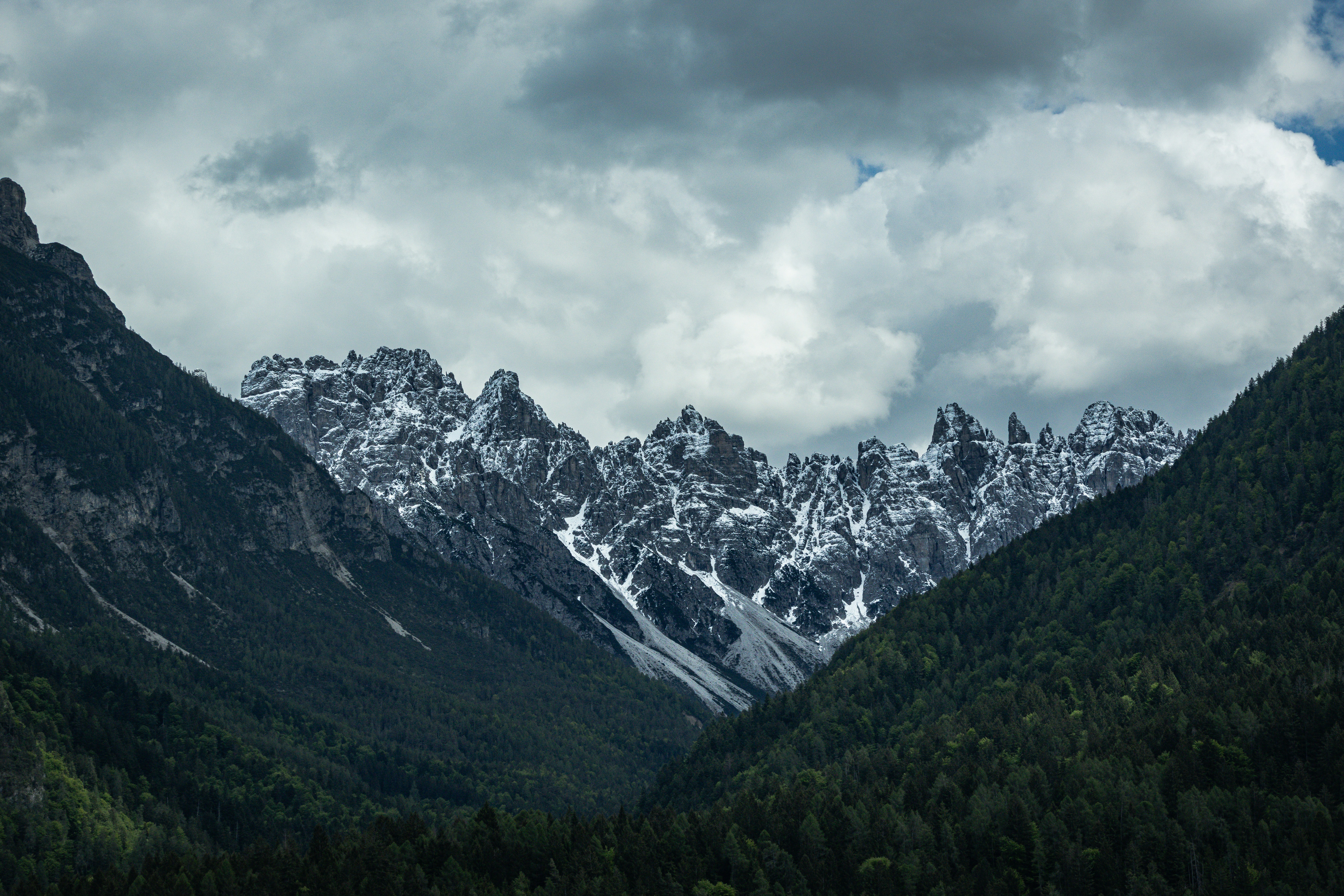 Mountains Snow Capped Mountains In A Valley Under A Cloudy Sky. 4K Wallpaper #3577