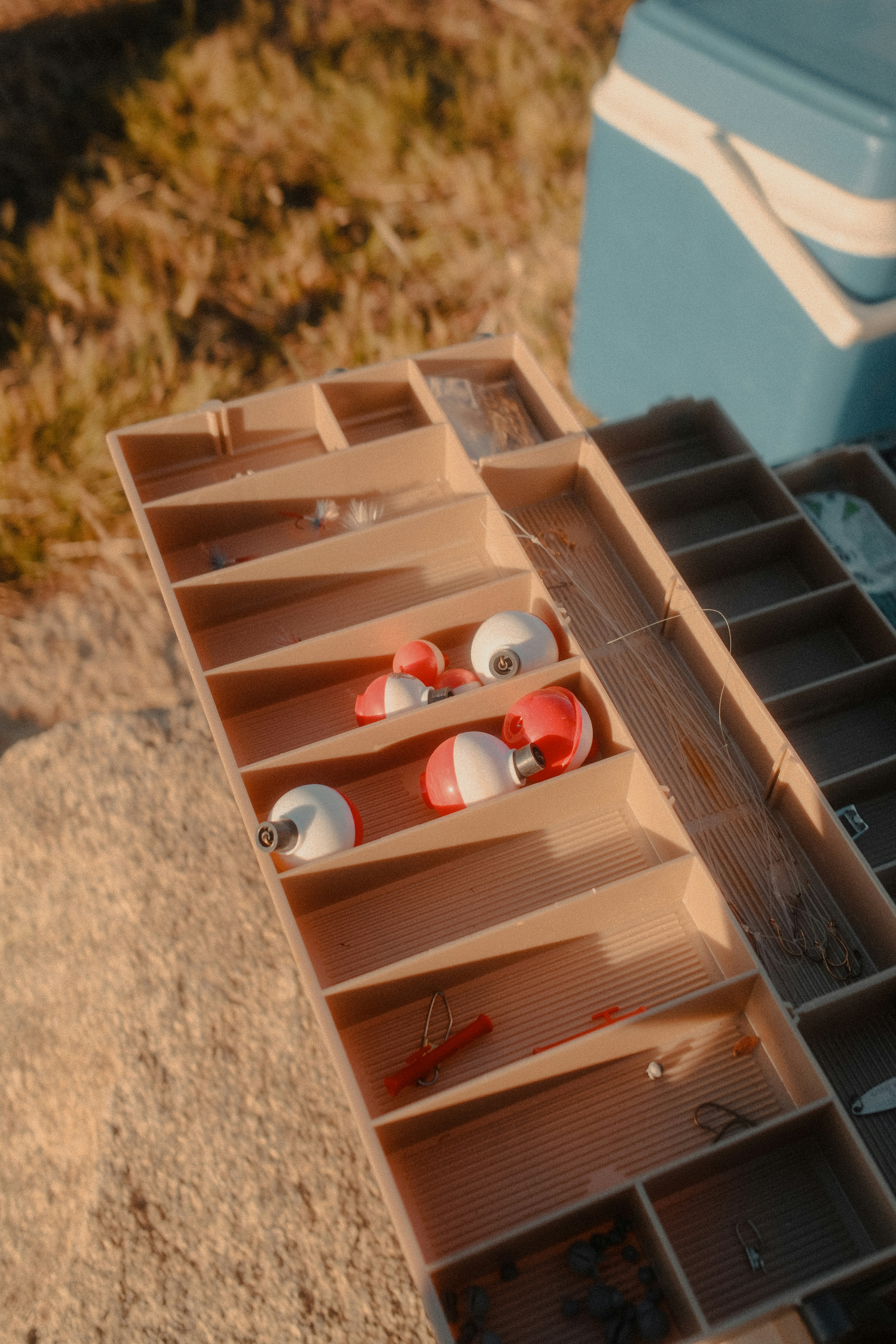 Open fishing tackle box with bobbers