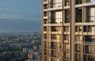 A modern high-rise building stands tall against a city skyline.