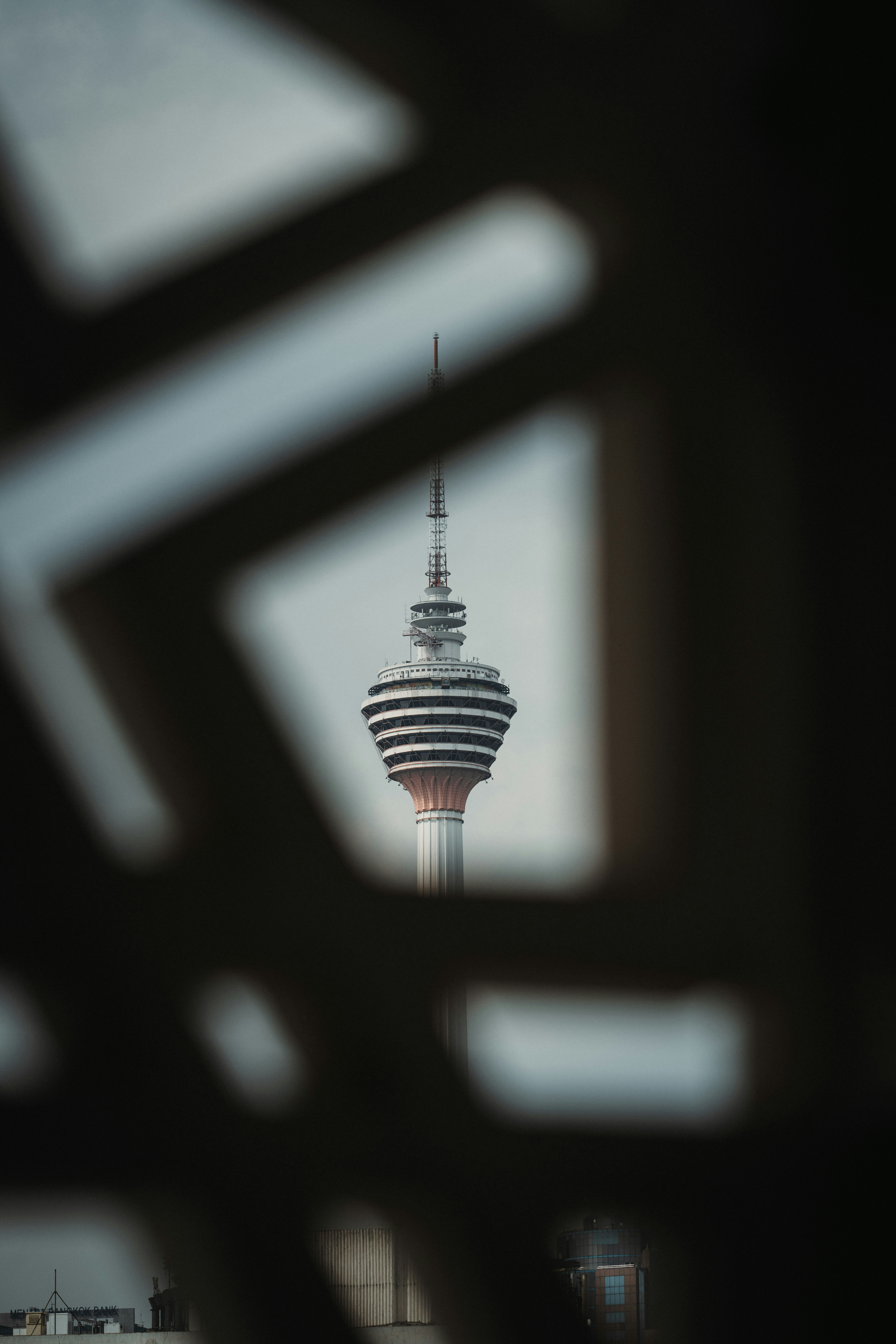Distinctive tower framed by dark patterned foreground
