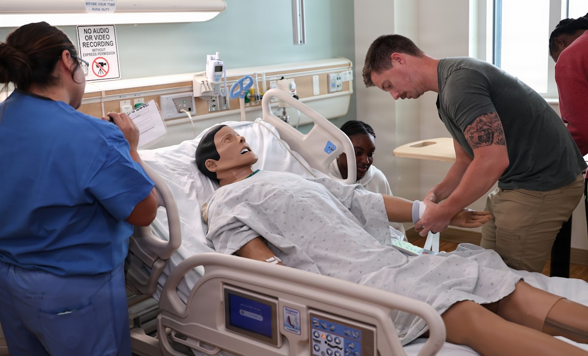 Nursing students practicing on a manikin in a simulation lab, a core setting for AI tools for nurse educators in 2026
