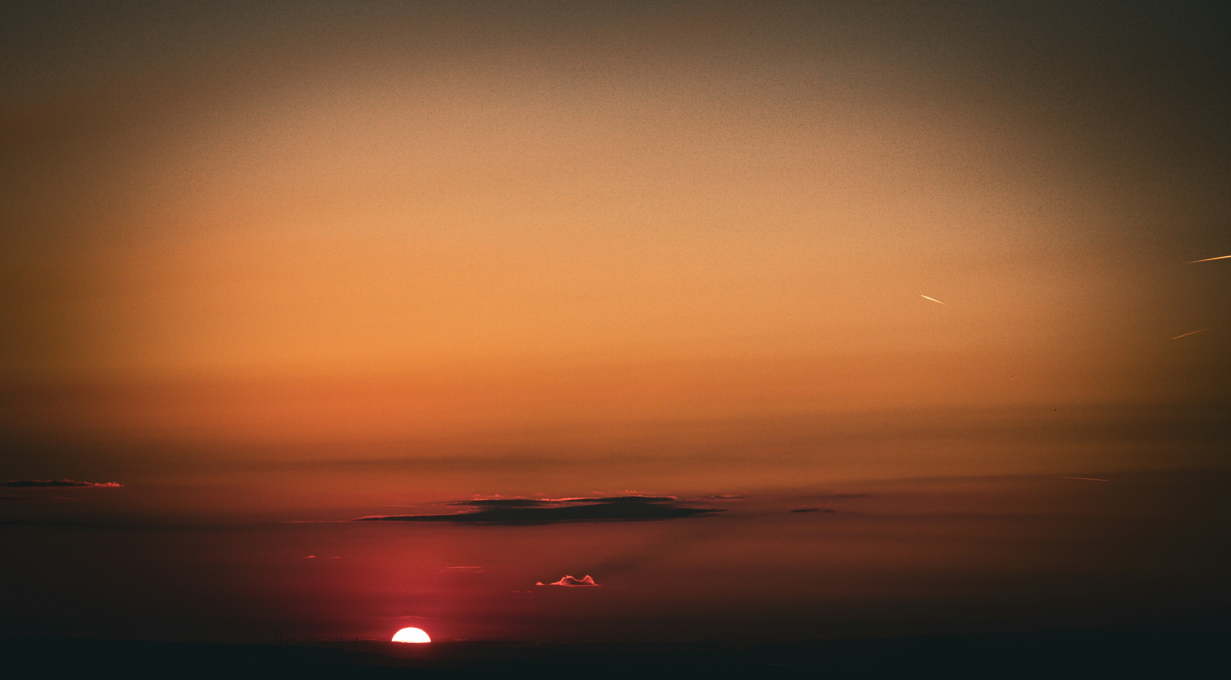 Beautiful orange and red sunset with a visible sun.