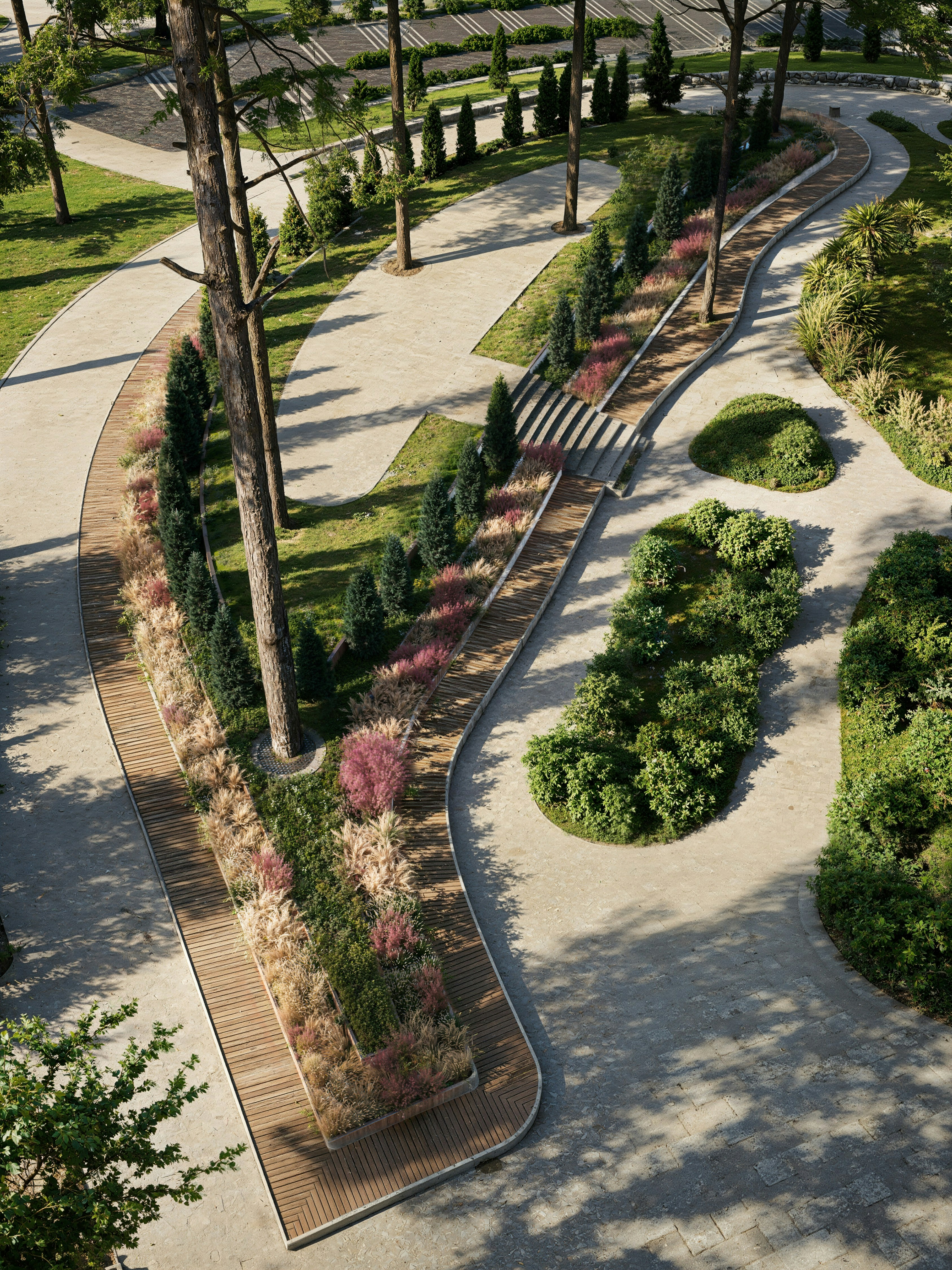 Modern park with winding paths, tall trees, and colorful plants.
