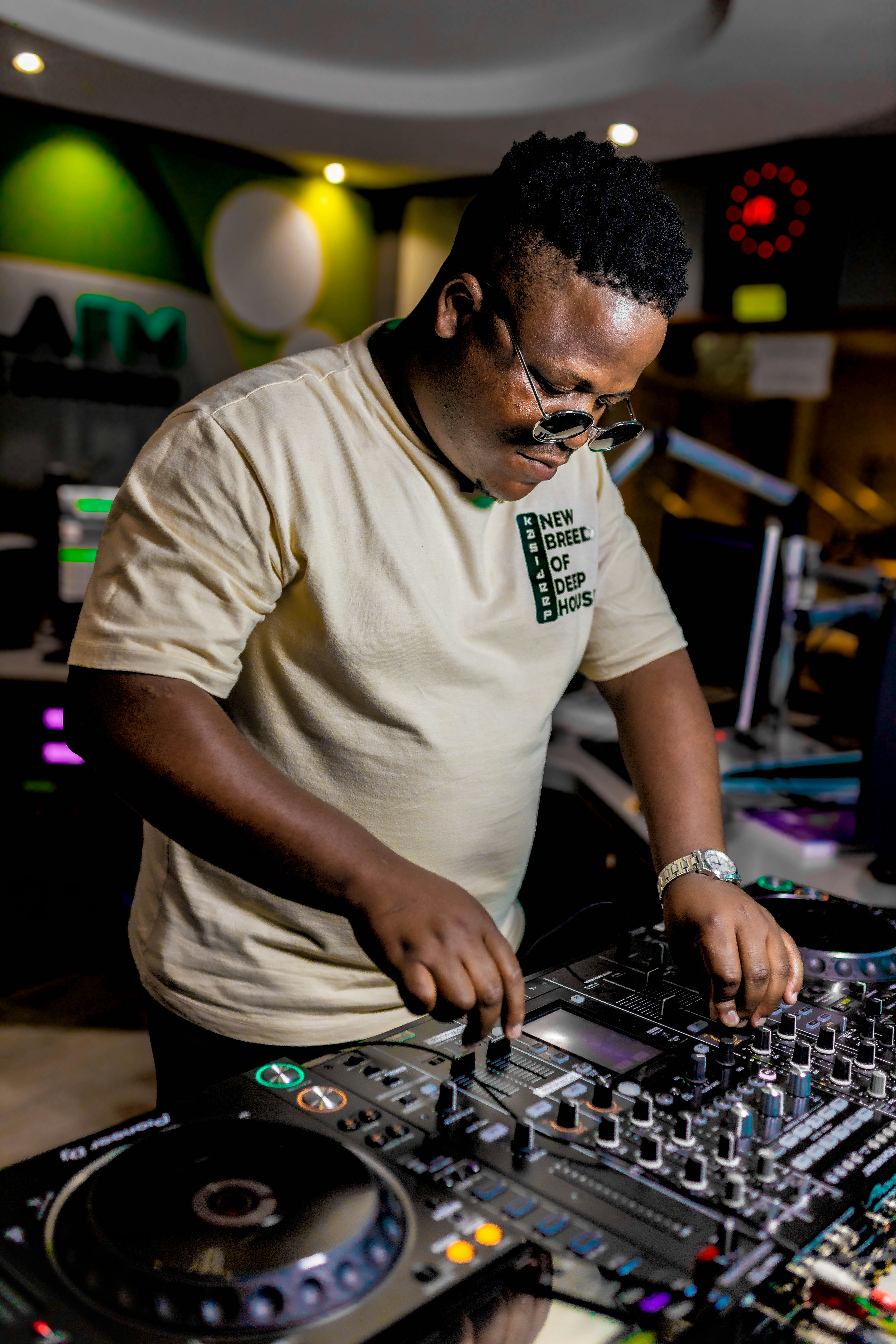 A man djing with professional audio equipment.