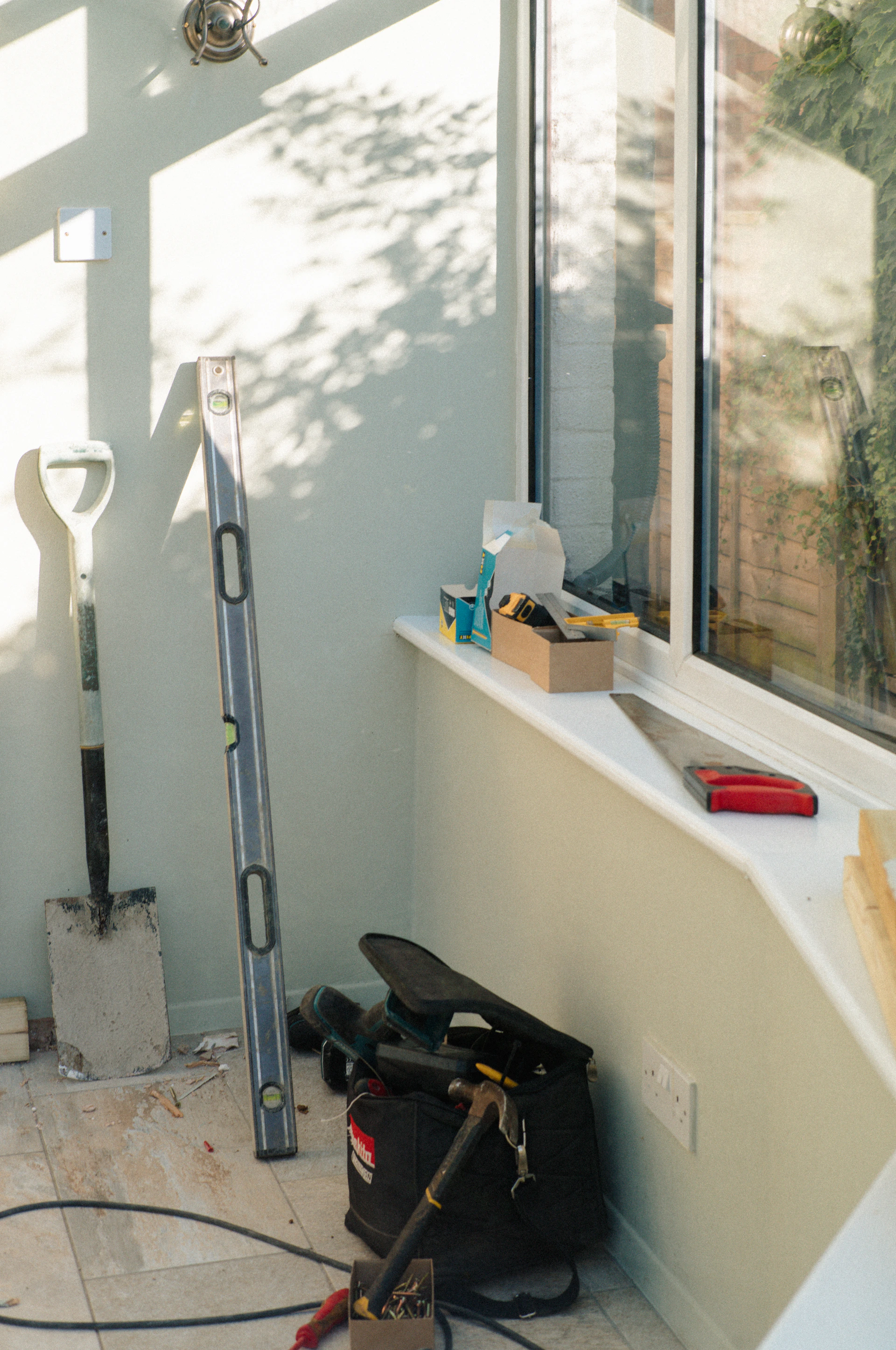 Construction tools and equipment in a sunlit room