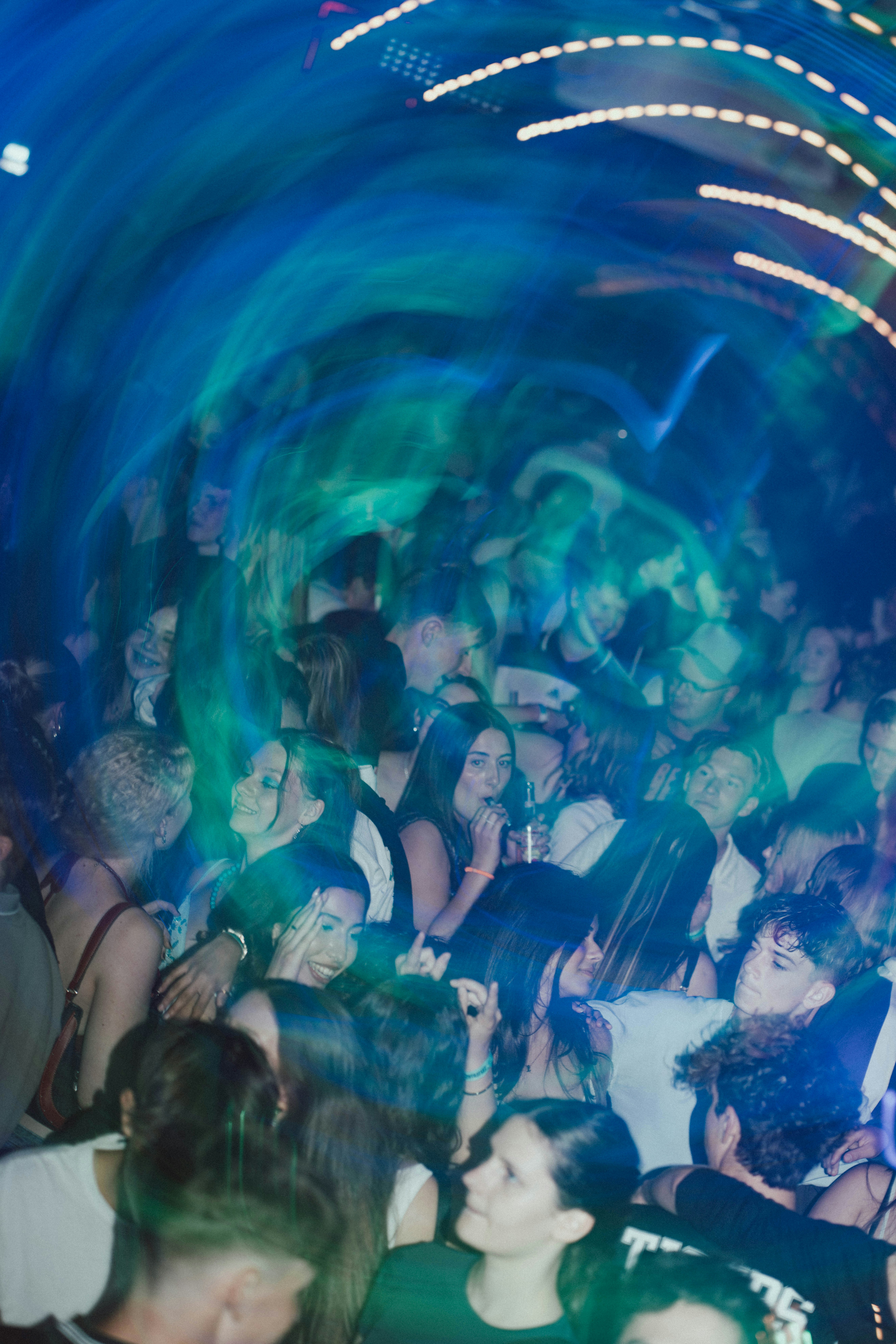 Motion blur over lively crowd with blue light