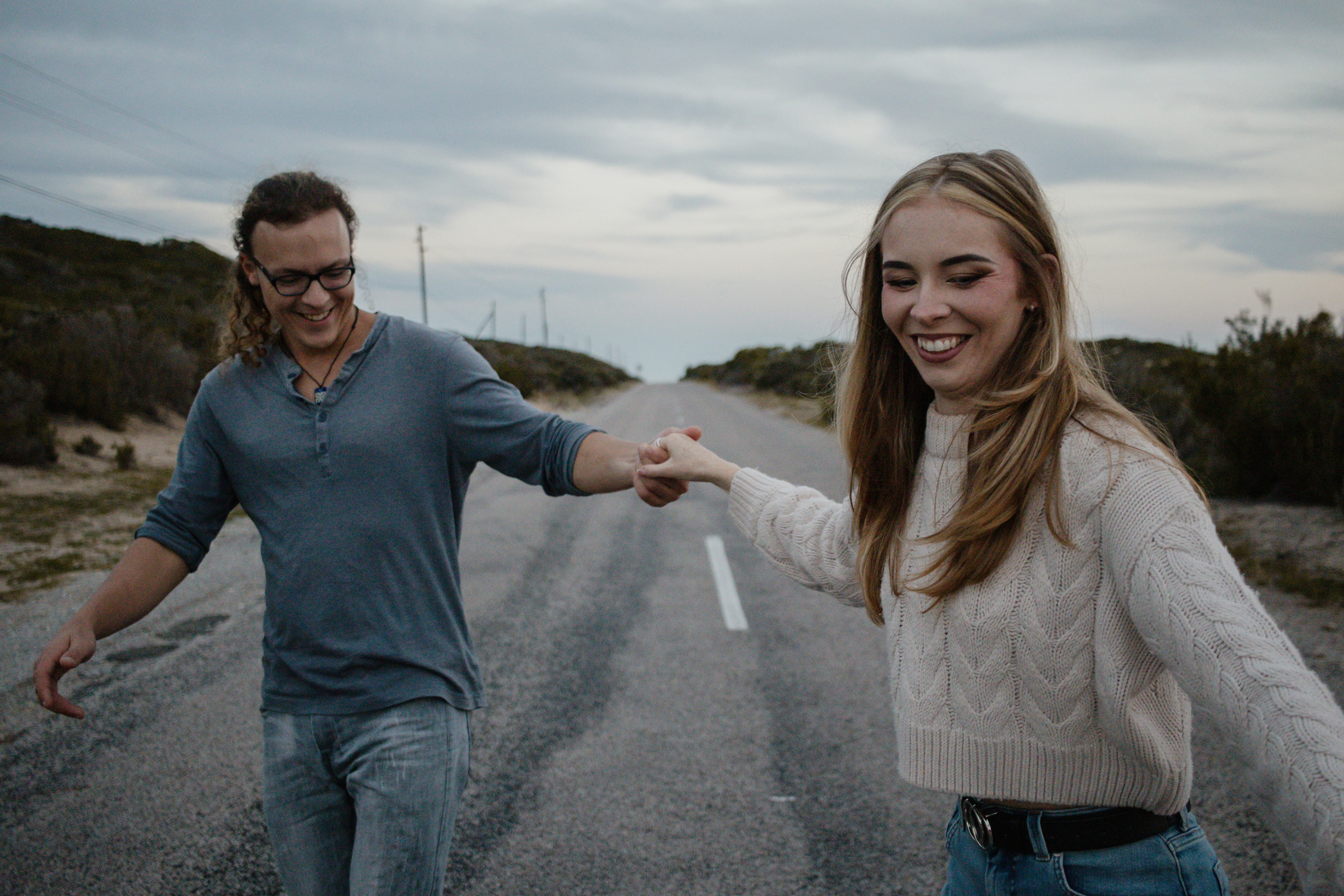Happy couple walking together outdoors after restoring relationship balance