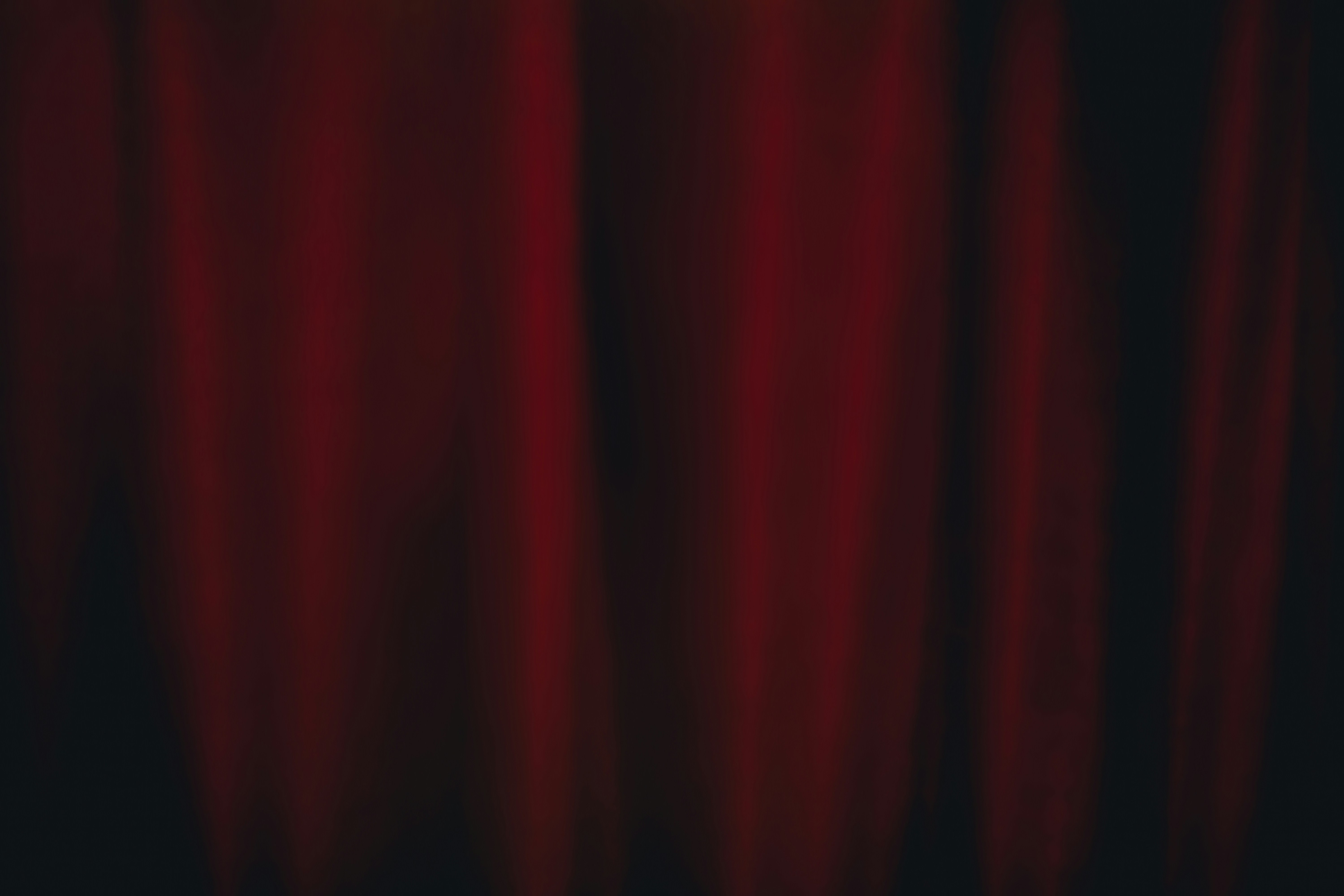 Red curtain backdrop with soft lighting