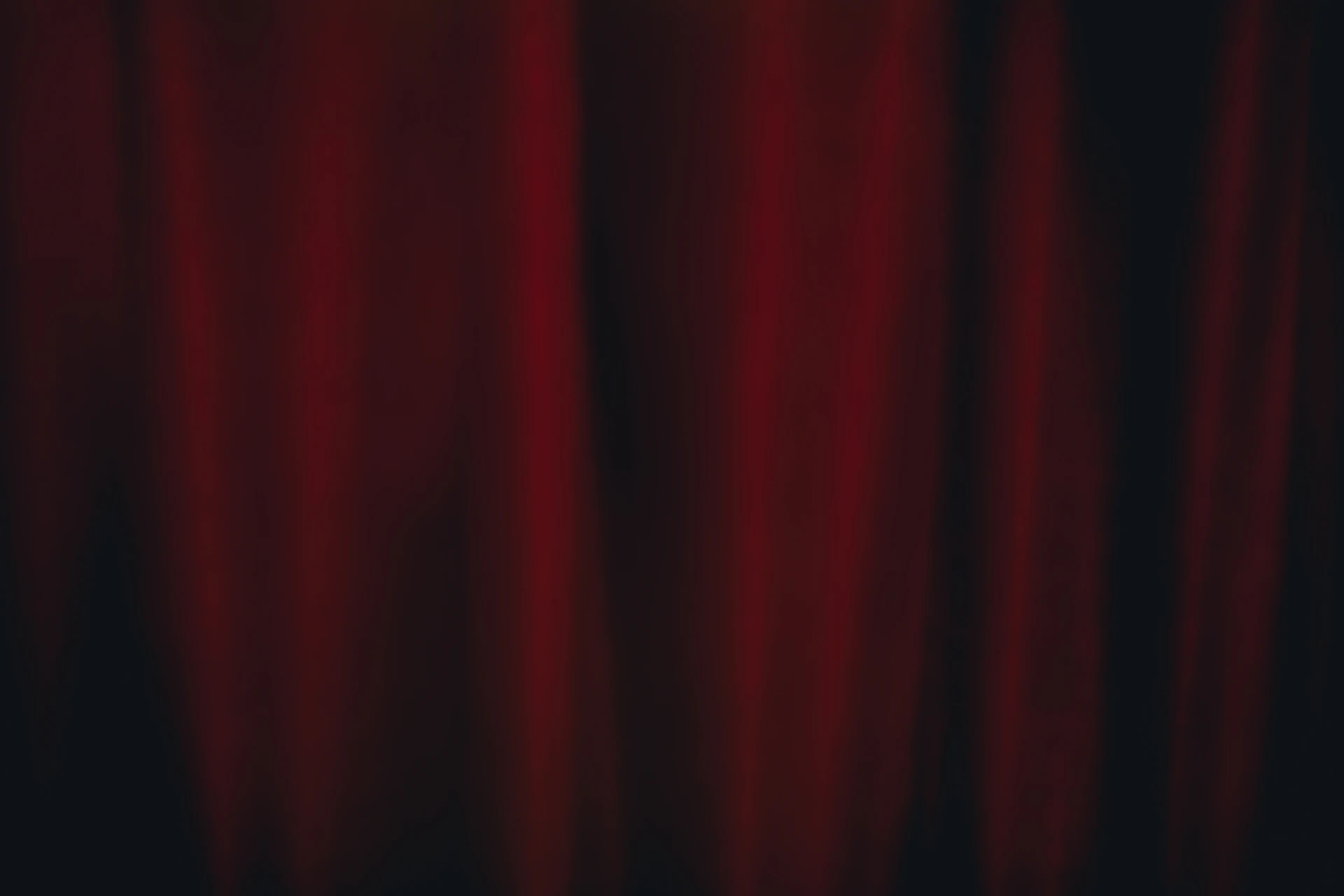 Red curtain backdrop with soft lighting