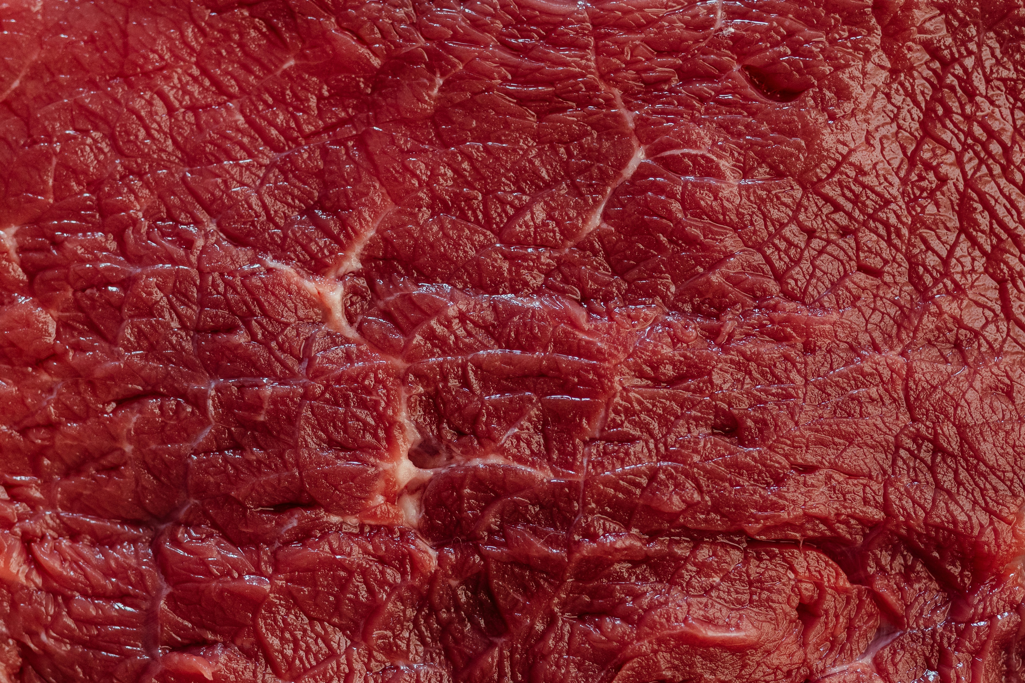 Close-up of fresh raw red meat texture.