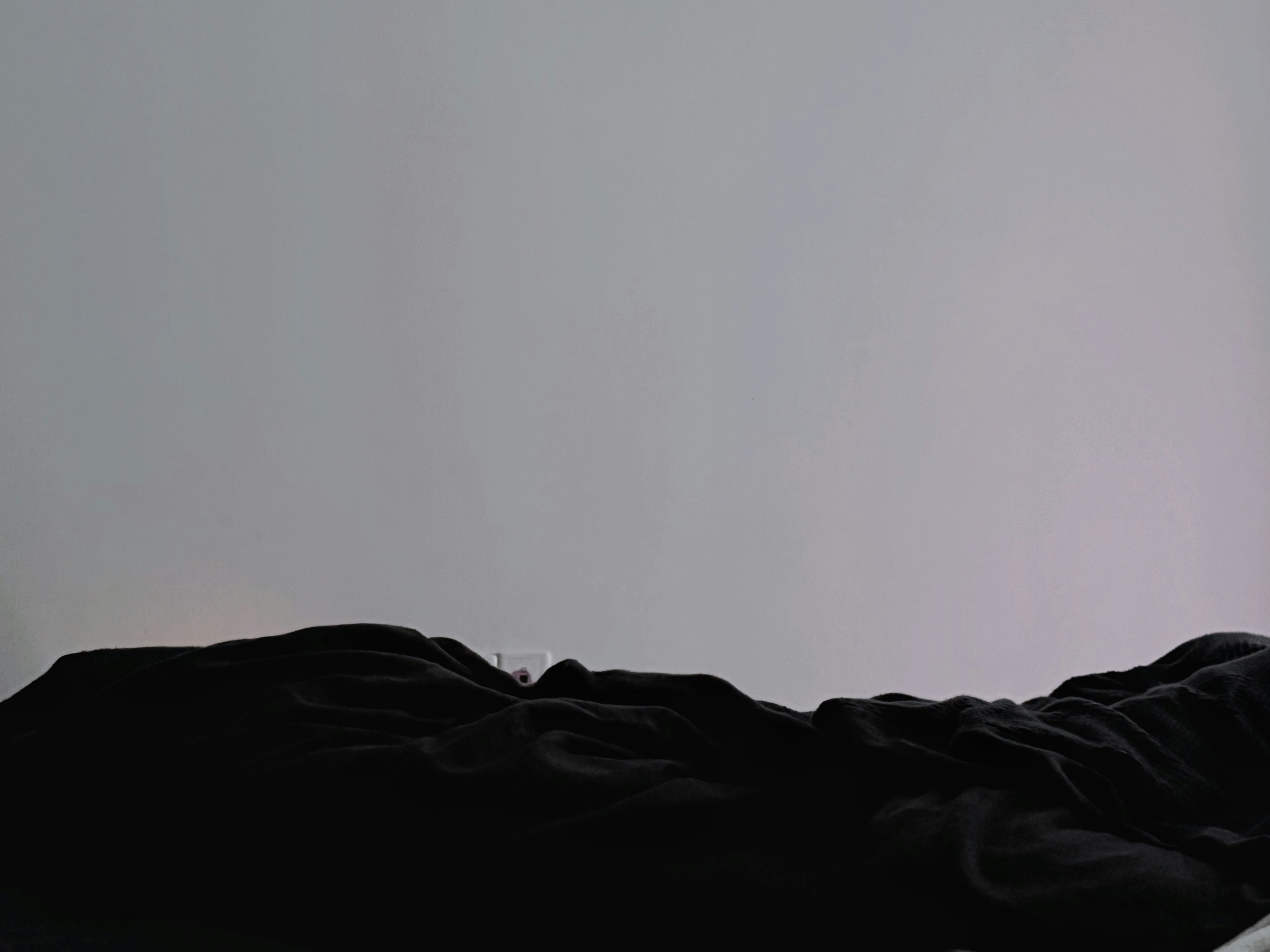 Dark Crumpled Fabric Against A Light Gray Background. 4K Wallpaper #3616