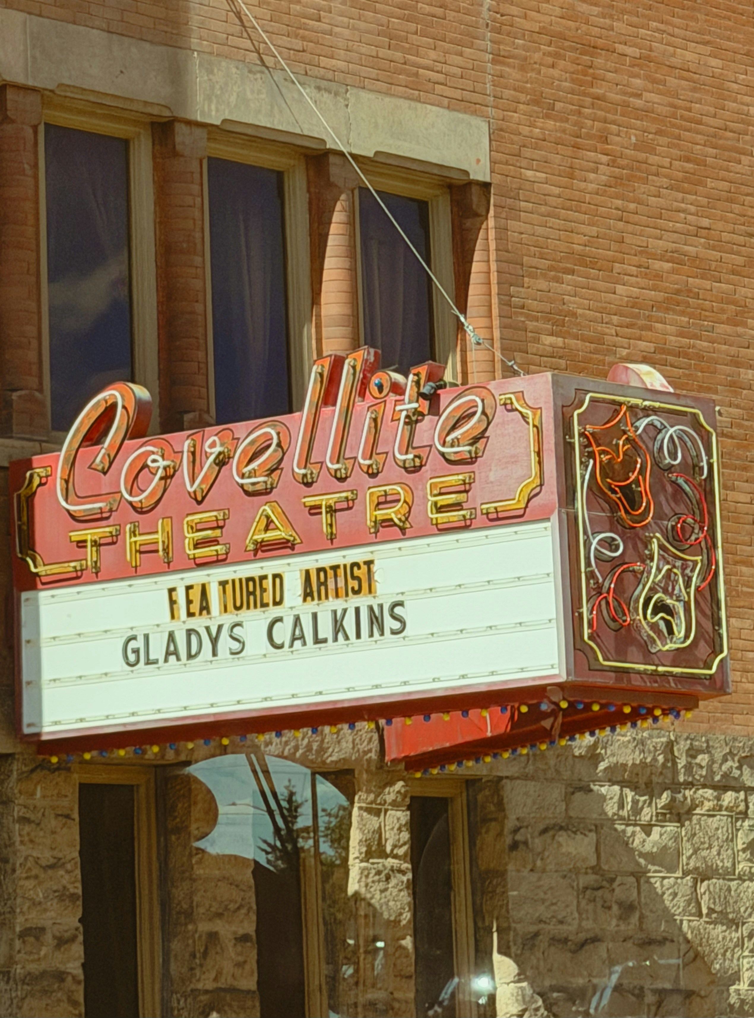 Neon lovellite theatre marquee featuring artist gladys calkins.