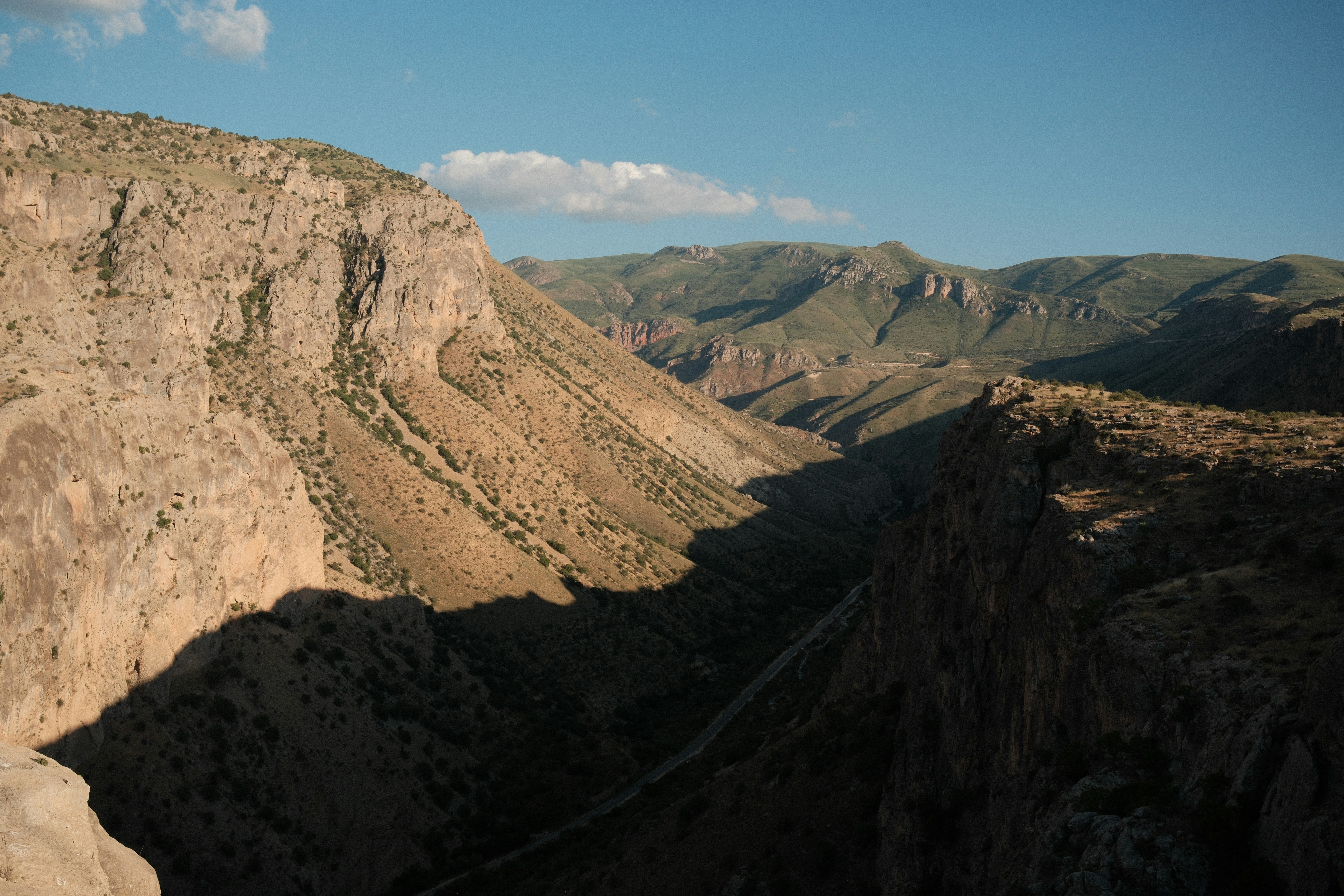 Deep canyon with rugged mountains and long shadows