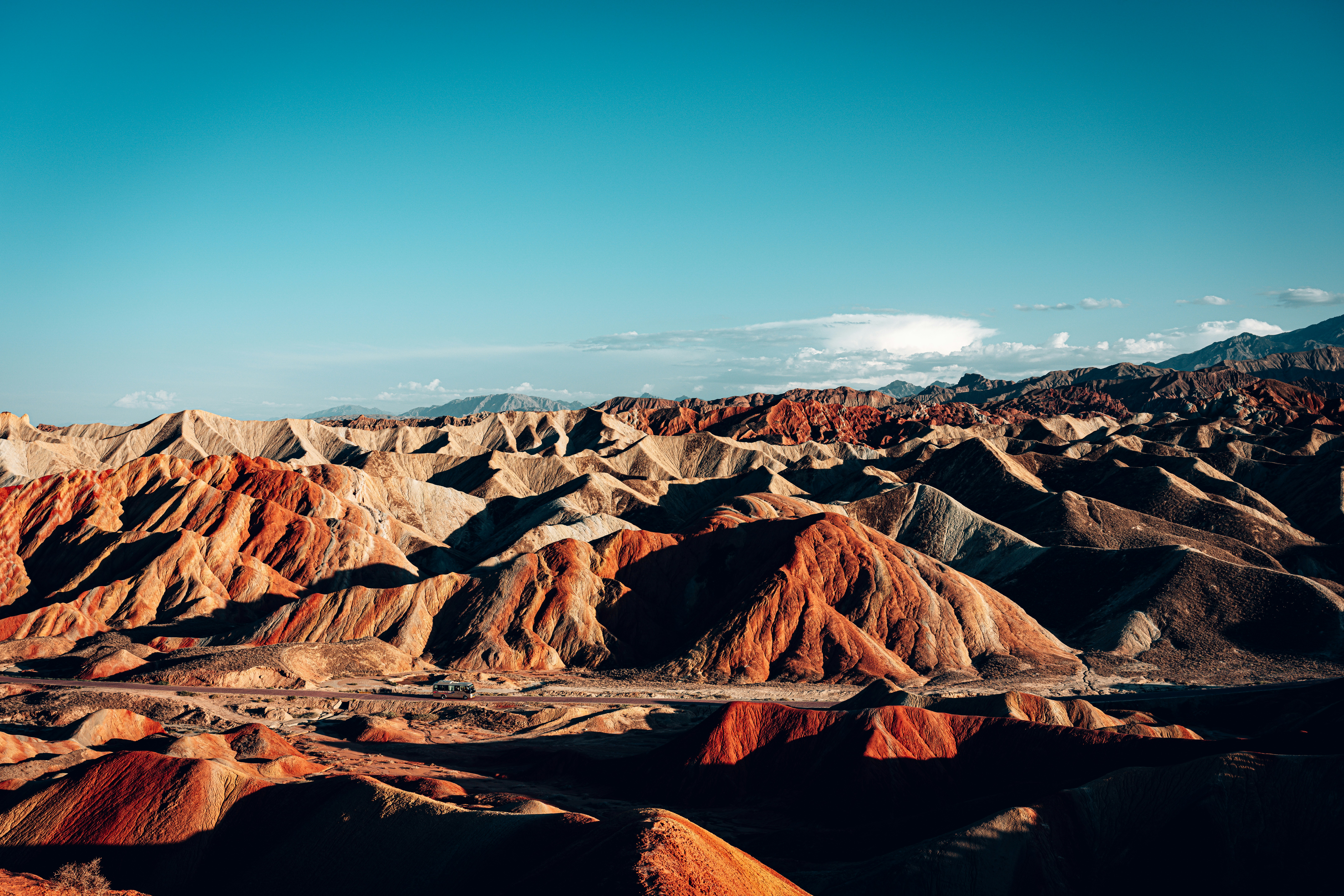 Colorful layered mountains under a clear blue sky