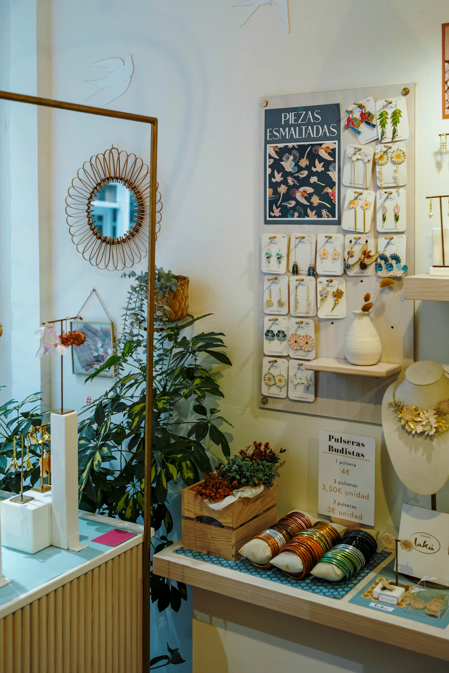 A warm independent boutique with plants and carefully arranged goods