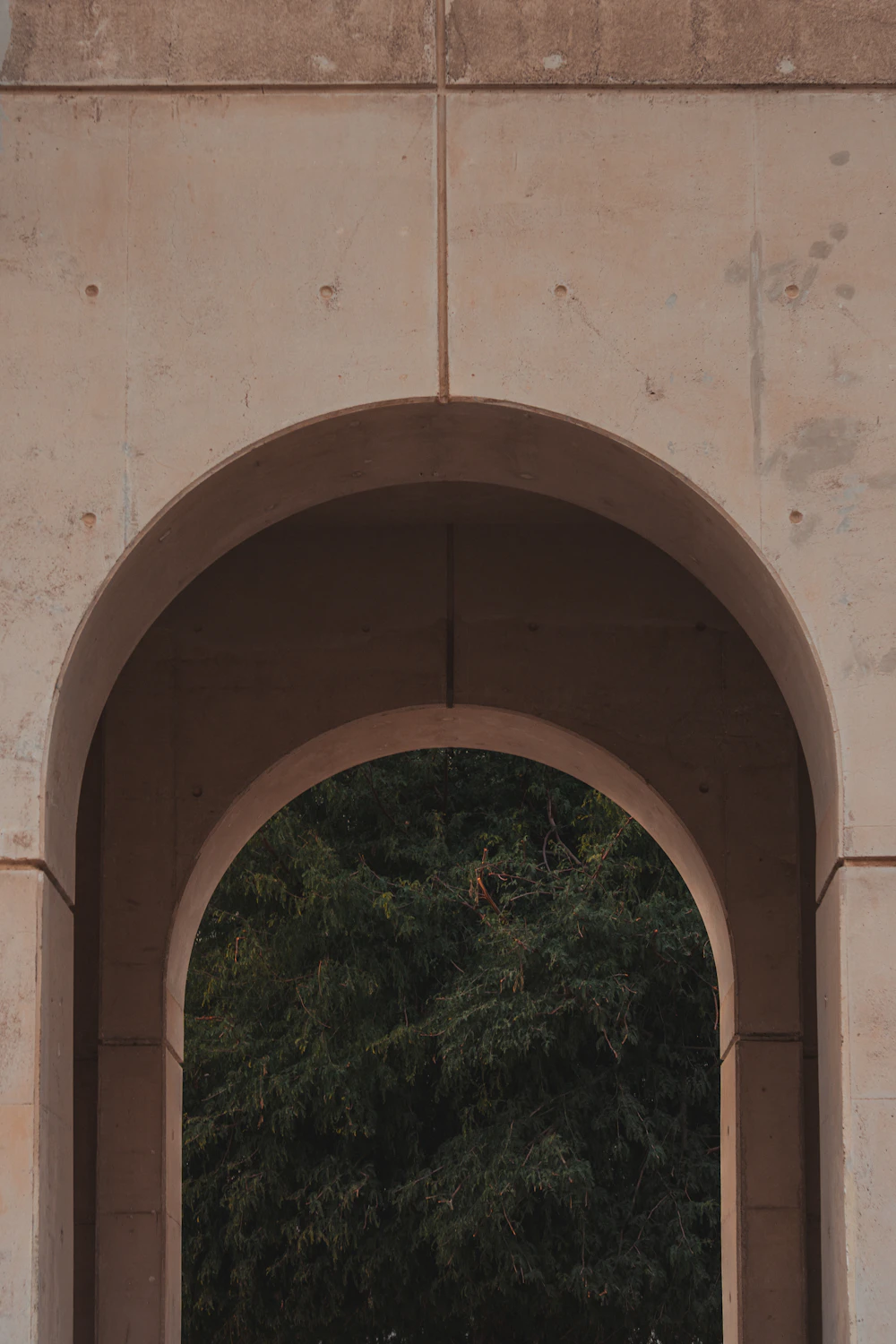 Stone archway framing greenery