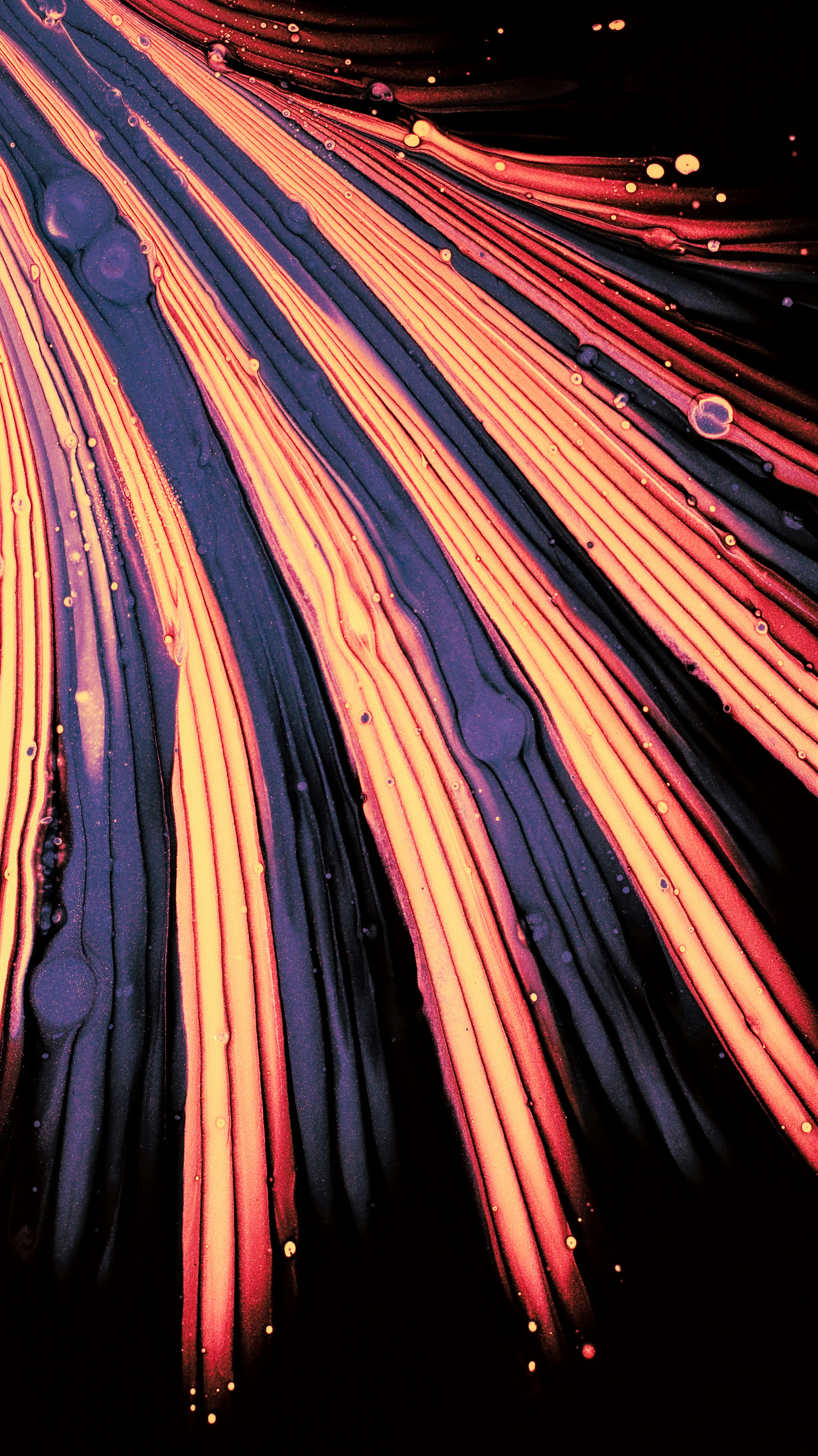 Photo of Orange, red, and purple fluid streaks on black background by Susan Wilkinson