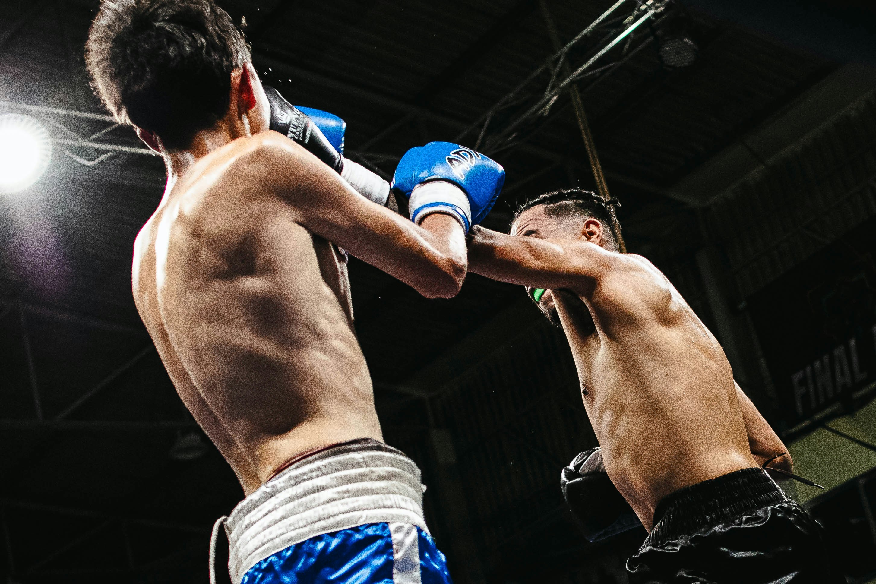 Boxers exchanging punches during a match
