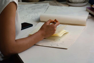 Hand tracing patterns on paper