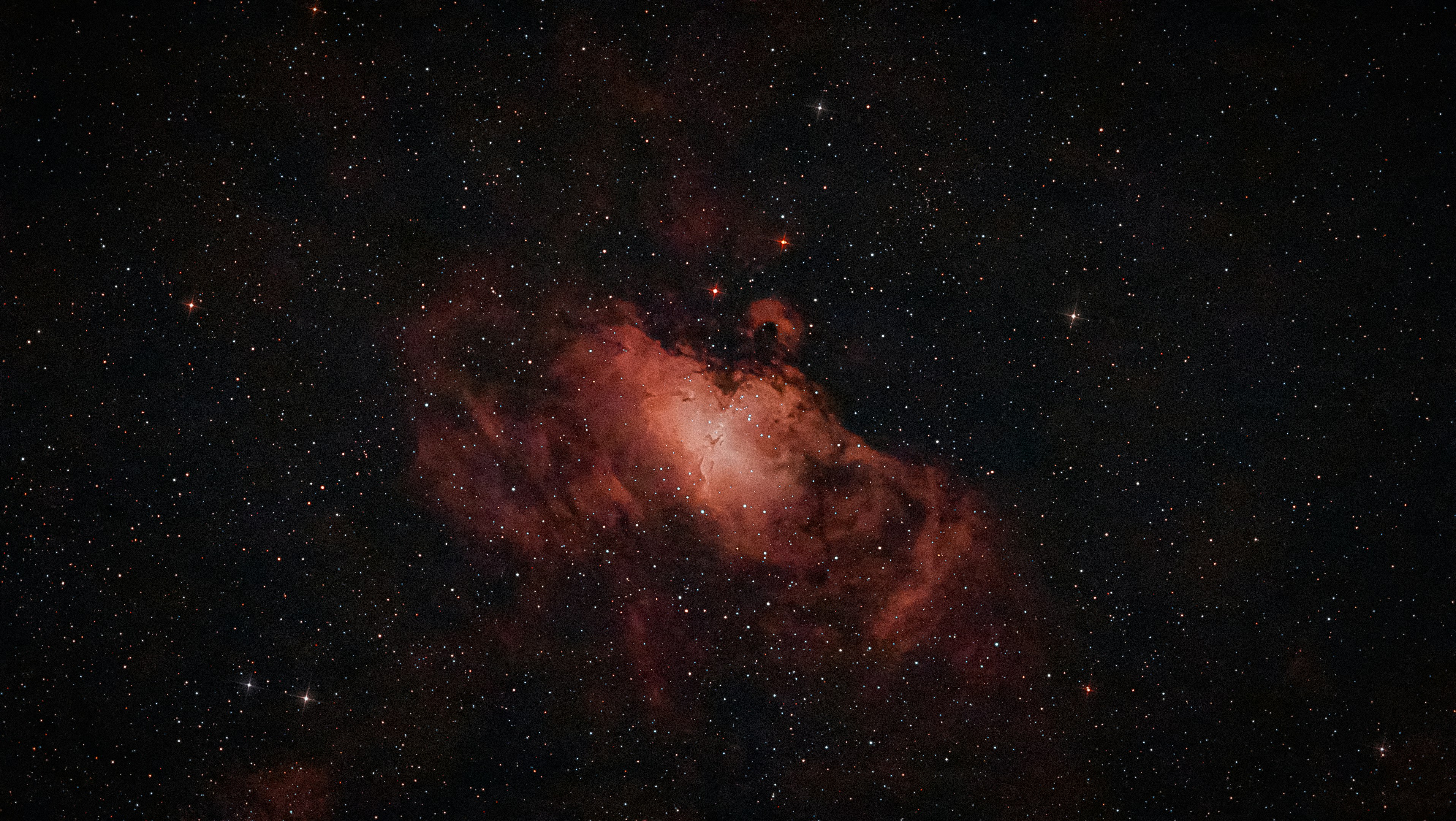 Photo of Red nebula surrounded by countless stars in deep space. by thibault henry