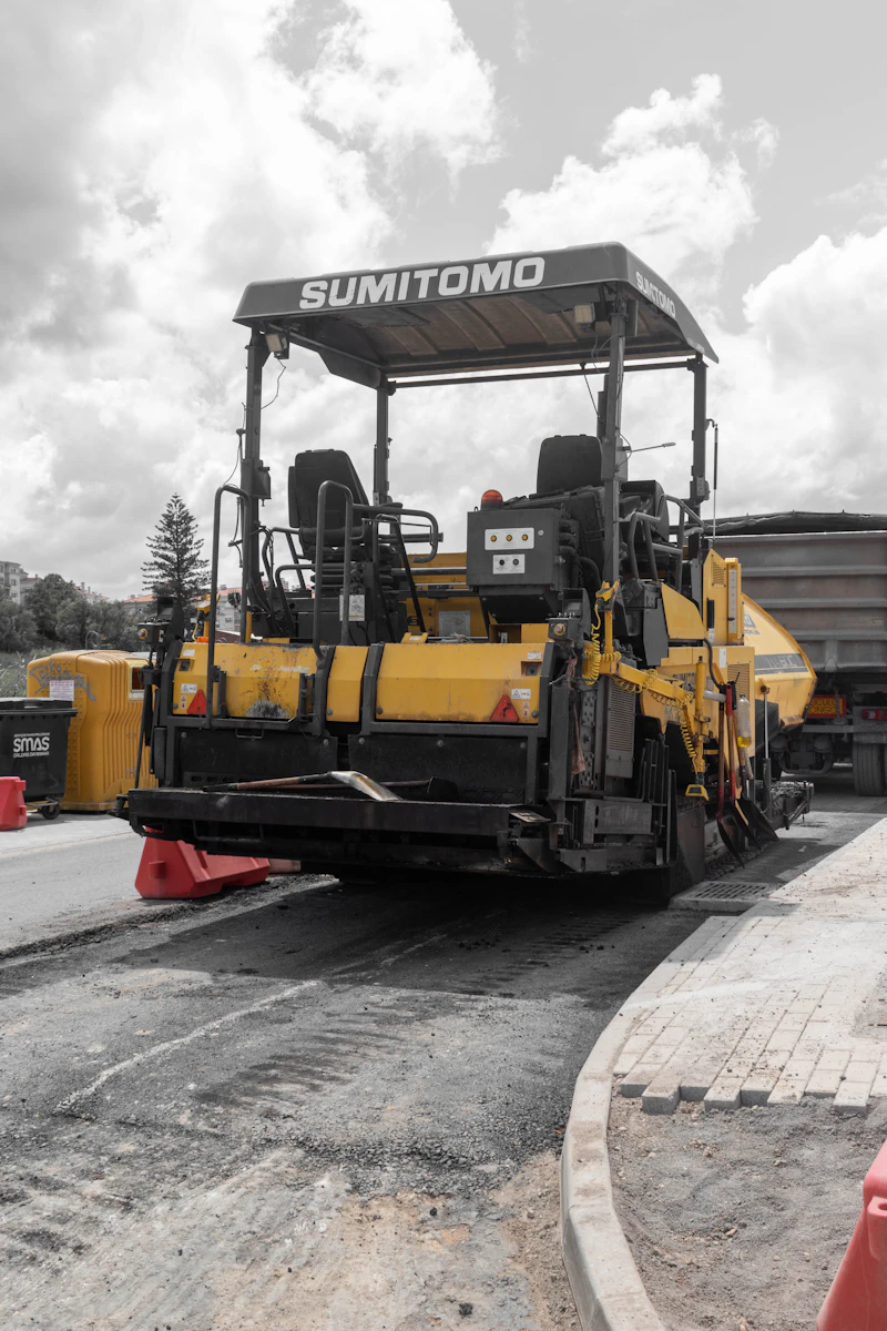 Asphalt paver laying new road surface
