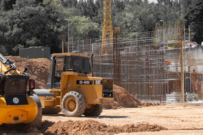 Heavy machinery and scaffolding at a construction site.