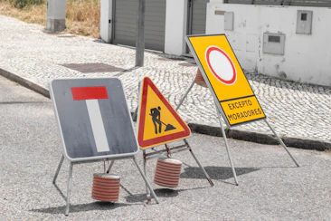 Various road signs indicating dead-end, construction, and limited access