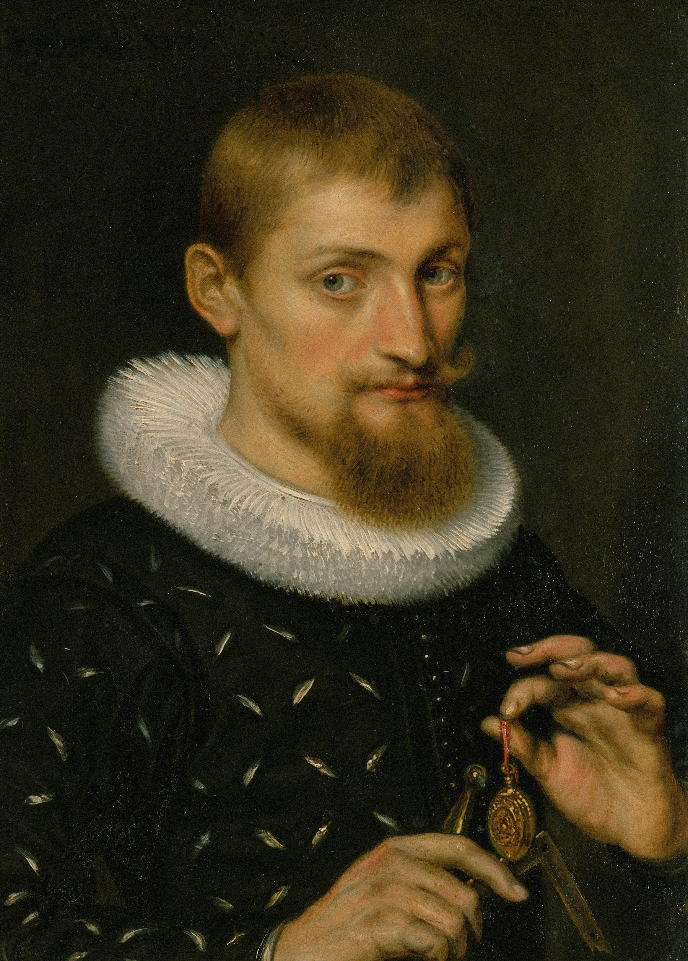 Bearded man in a ruff holds a golden medallion