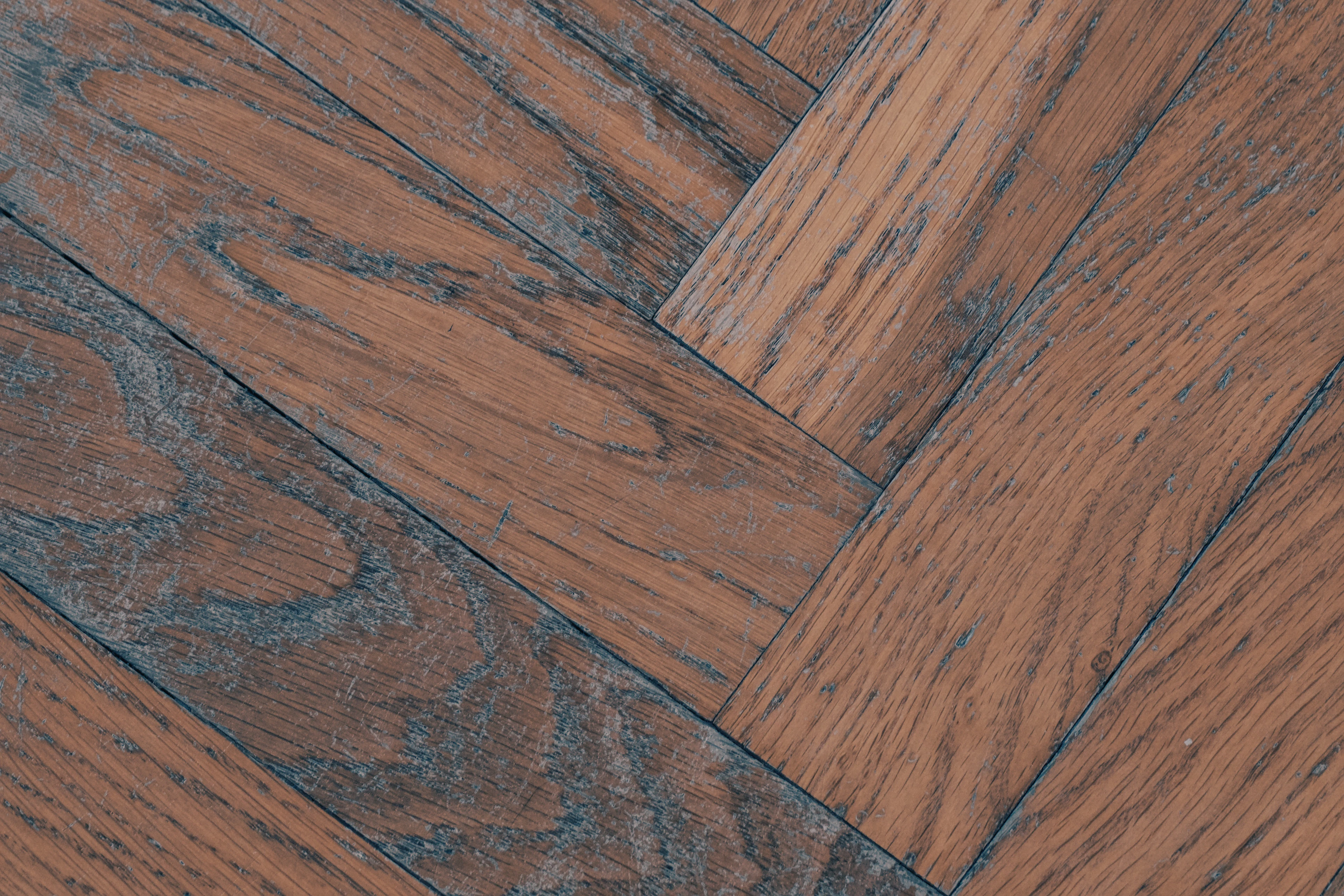 Reddish-brown herringbone floor