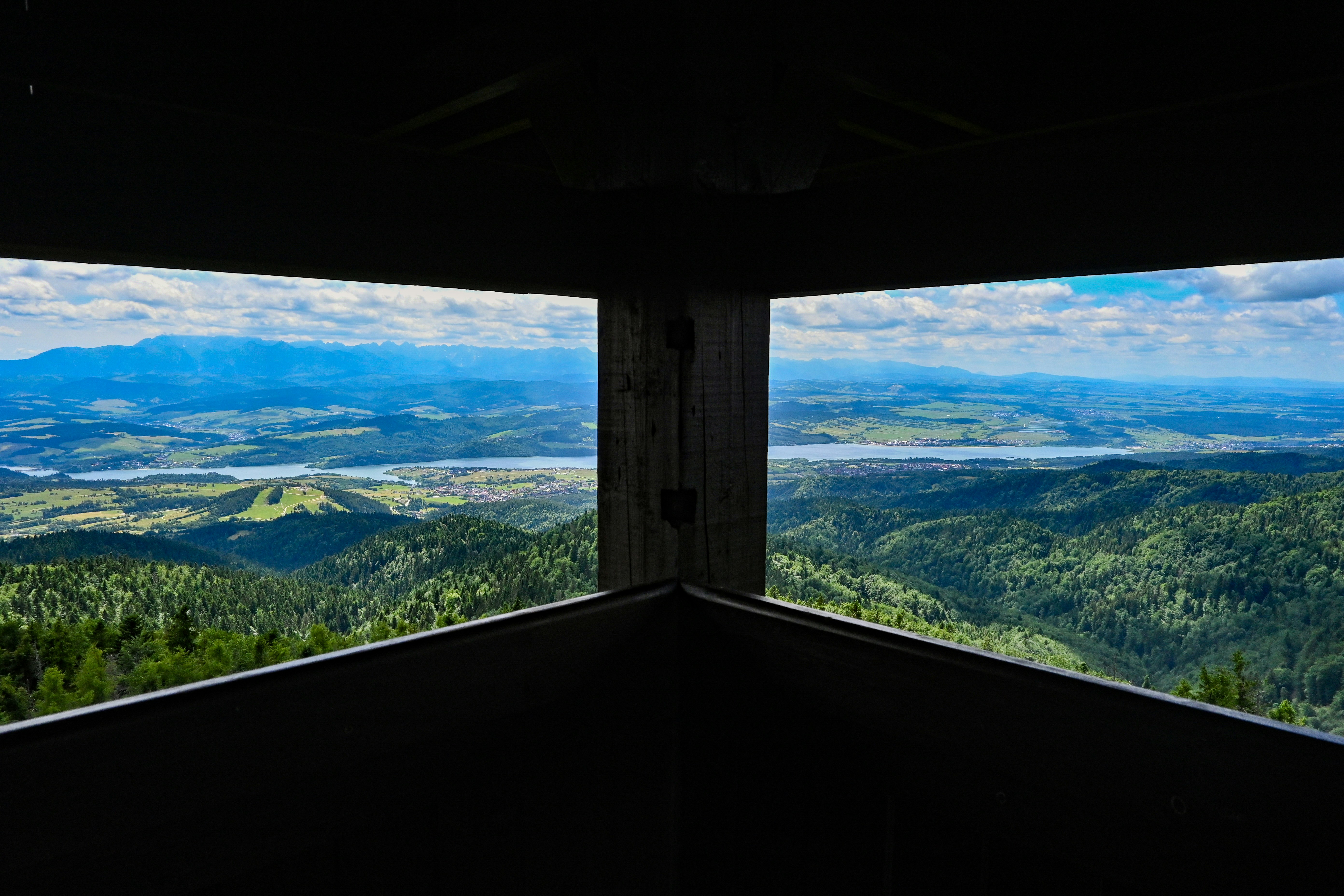 Mountain landscape with river framed by dark structure in poland