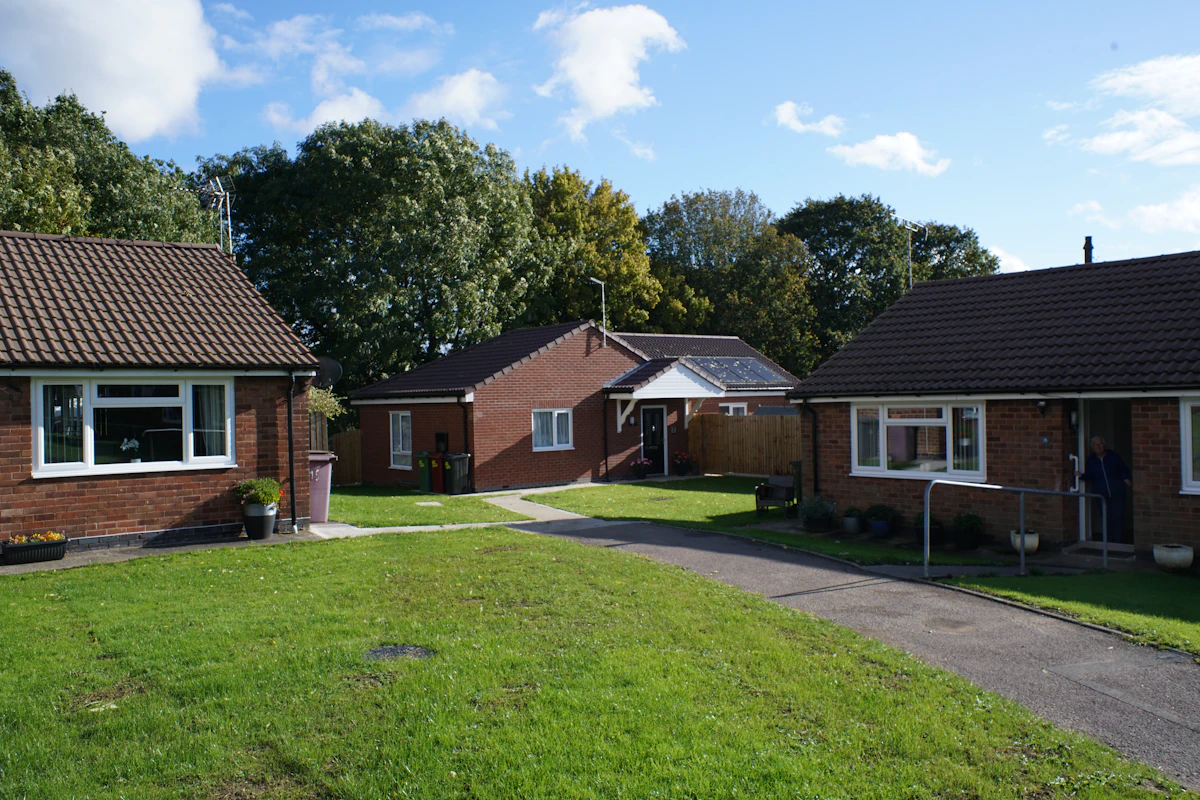 Brick bungalows with lawns and mature trees