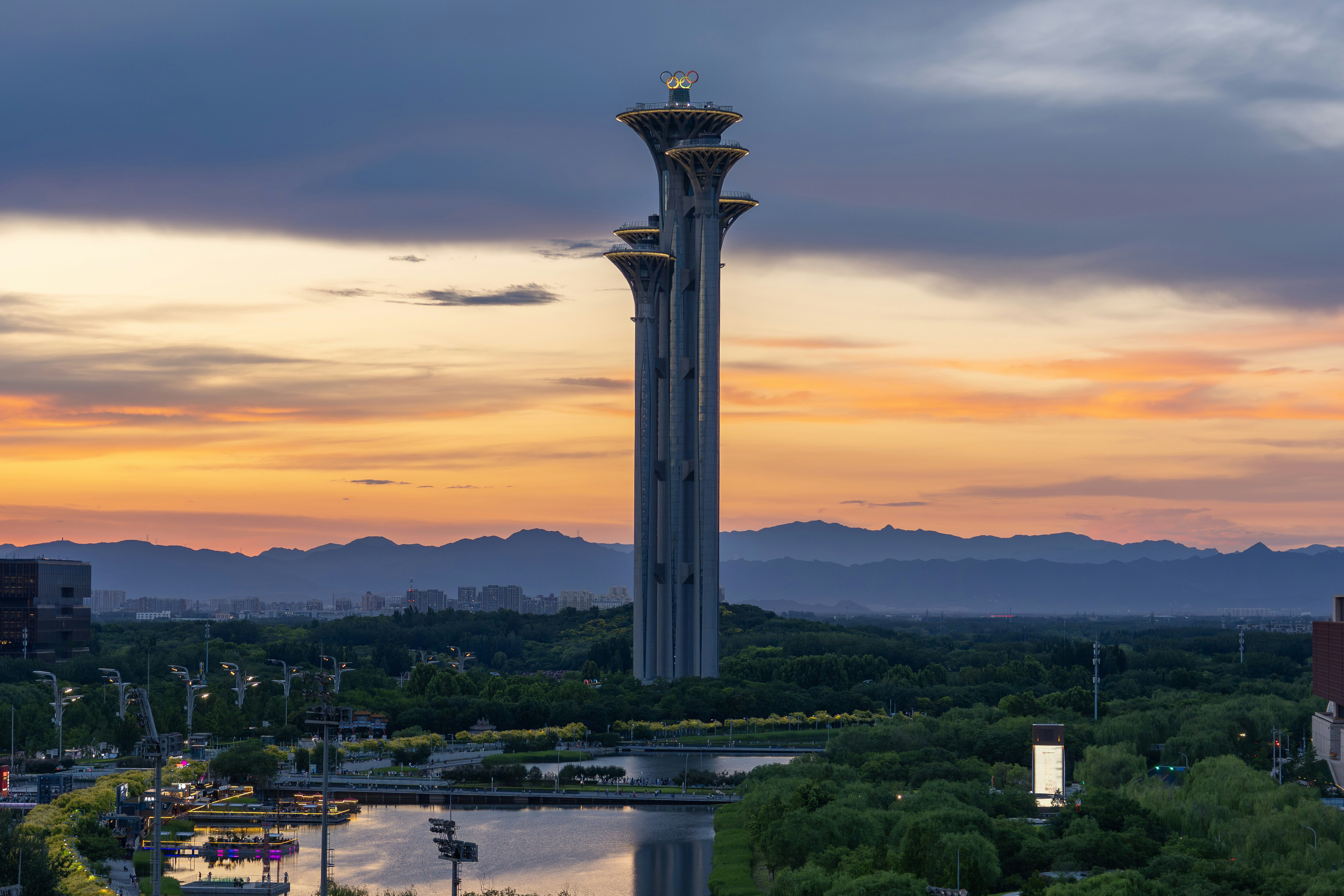 Beijing olympic tower against a dramatic sunset sky.